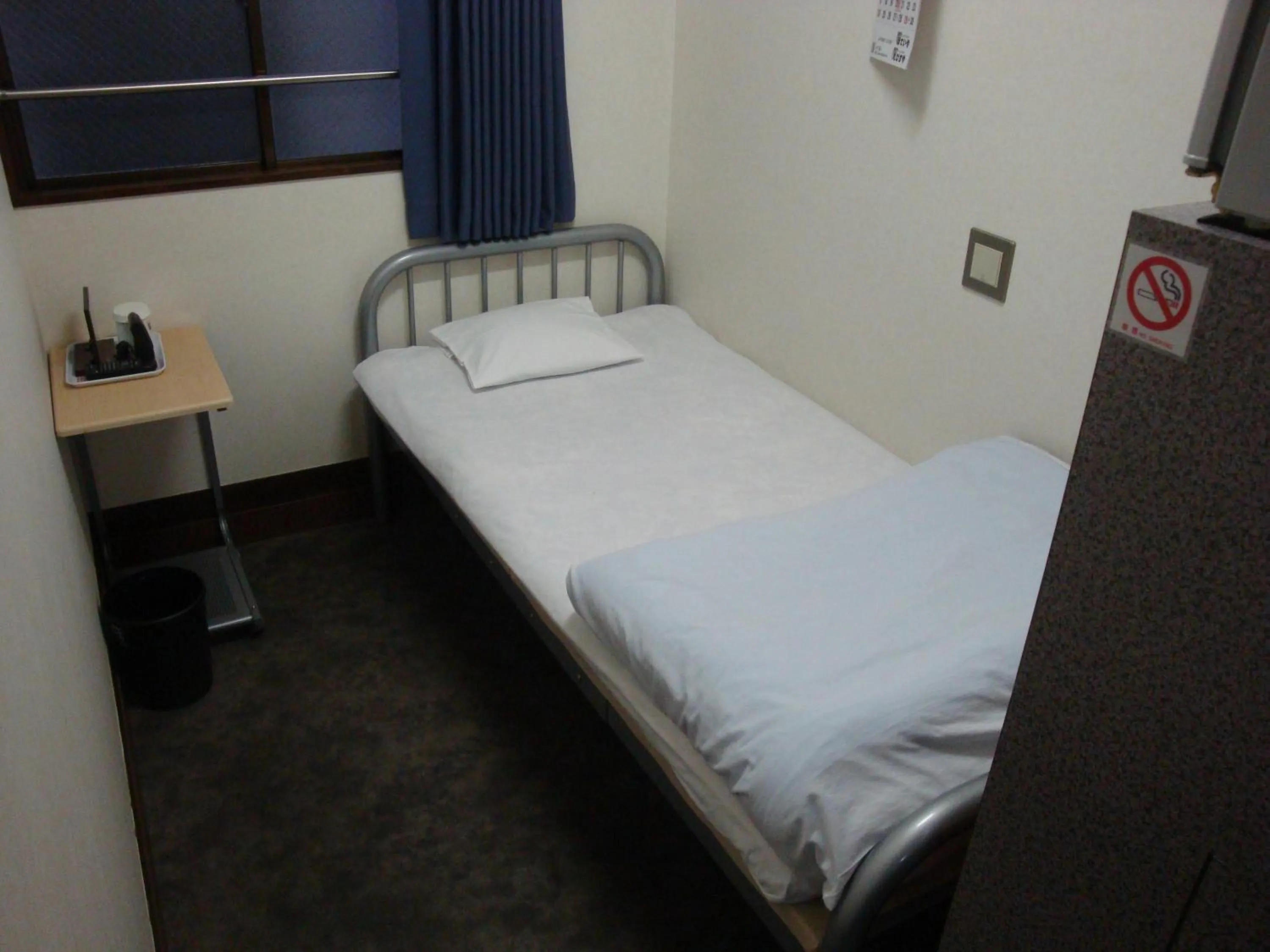 Bed in Economy Hotel Hoteiya