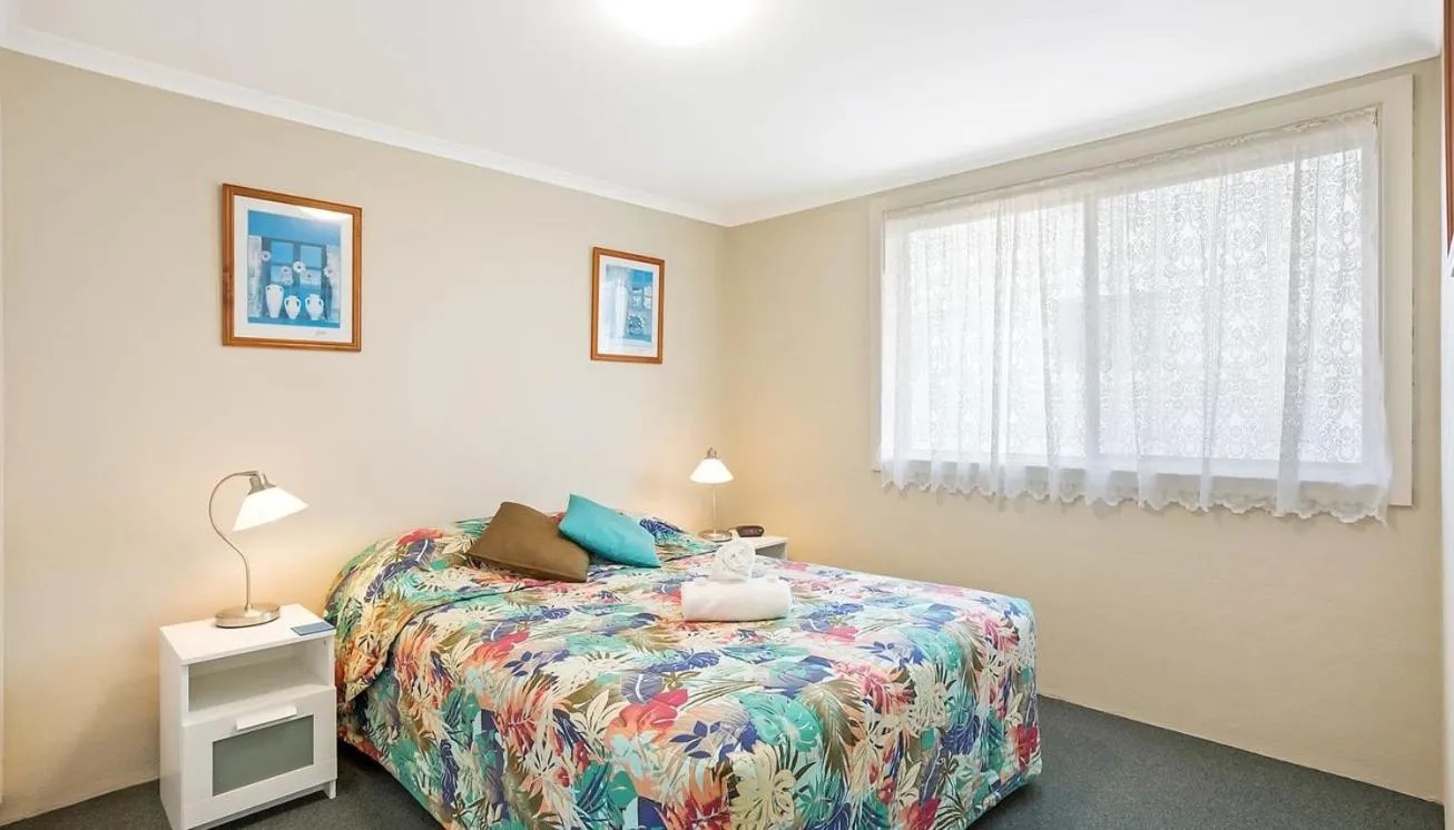 Bed in Surfside Merimbula Holiday Apartments