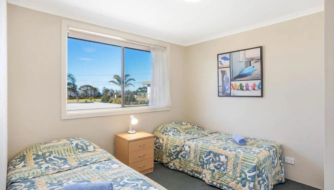 Bed in Surfside Merimbula Holiday Apartments