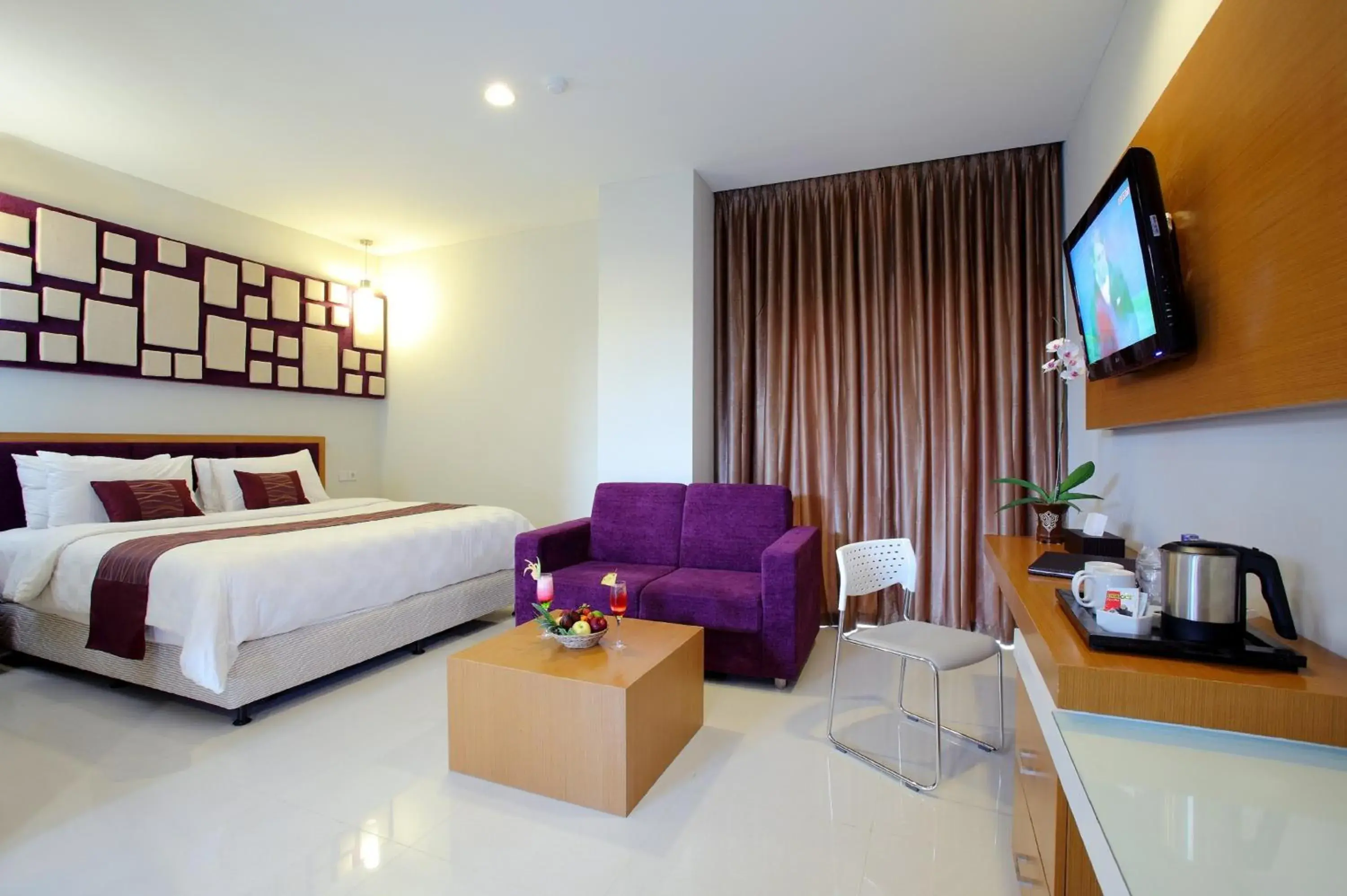 Seating area, Bed in Lombok Plaza Hotel and Convention Seating area, Bed in Lombok Plaza Hotel and Convention