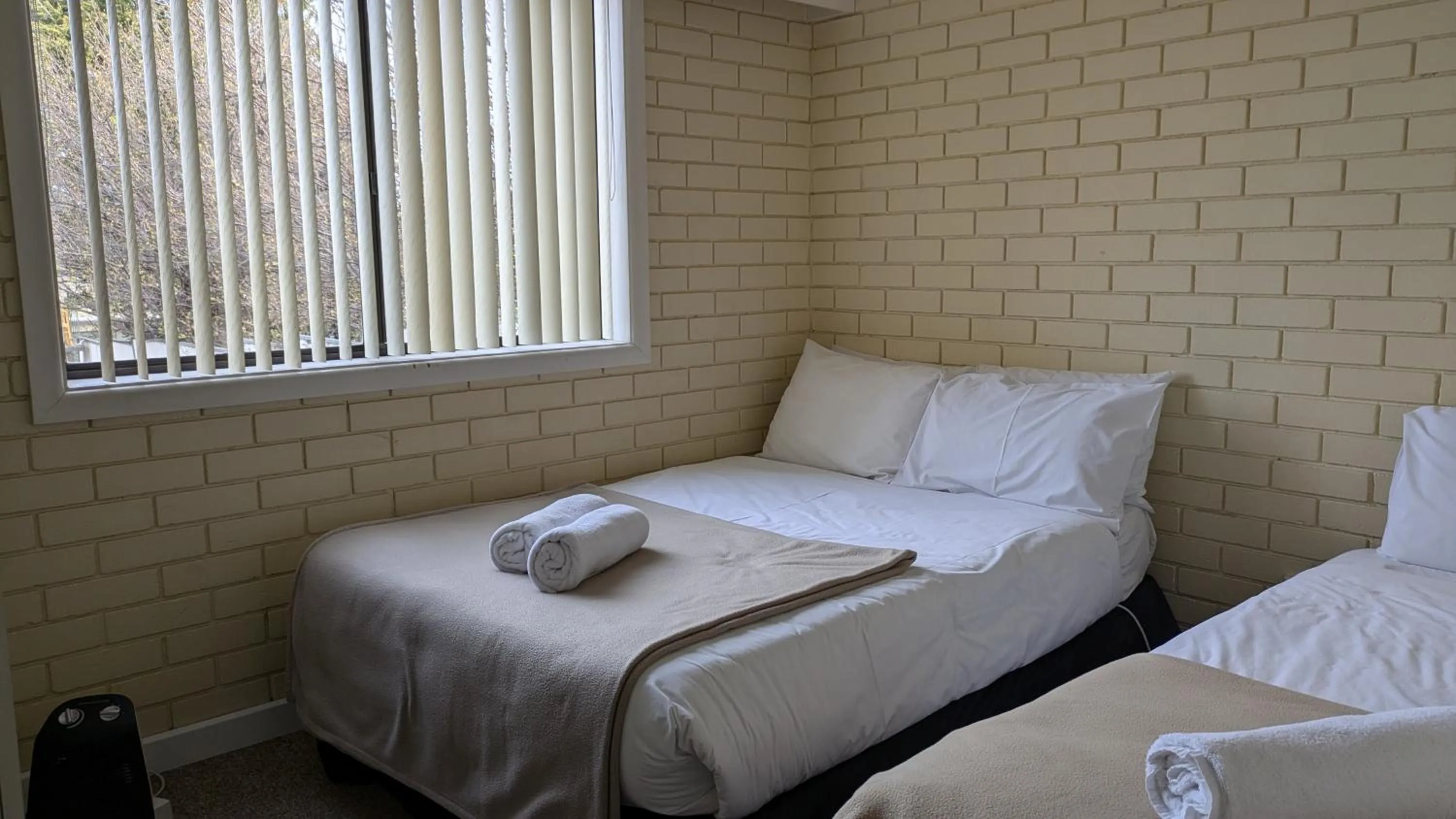 Bed in The Swiss Motel