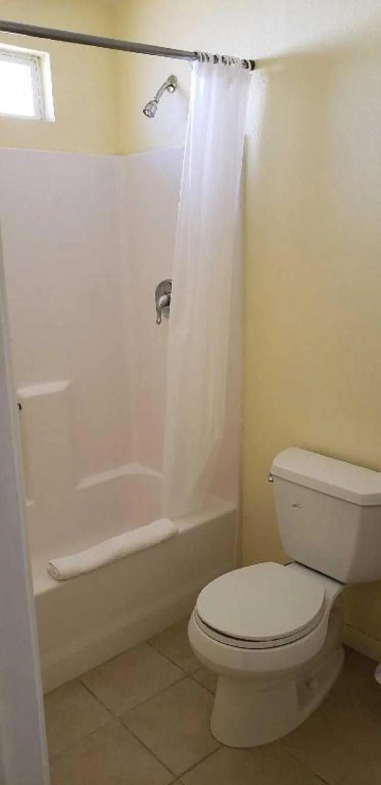 Toilet in Europa Inn & Suites