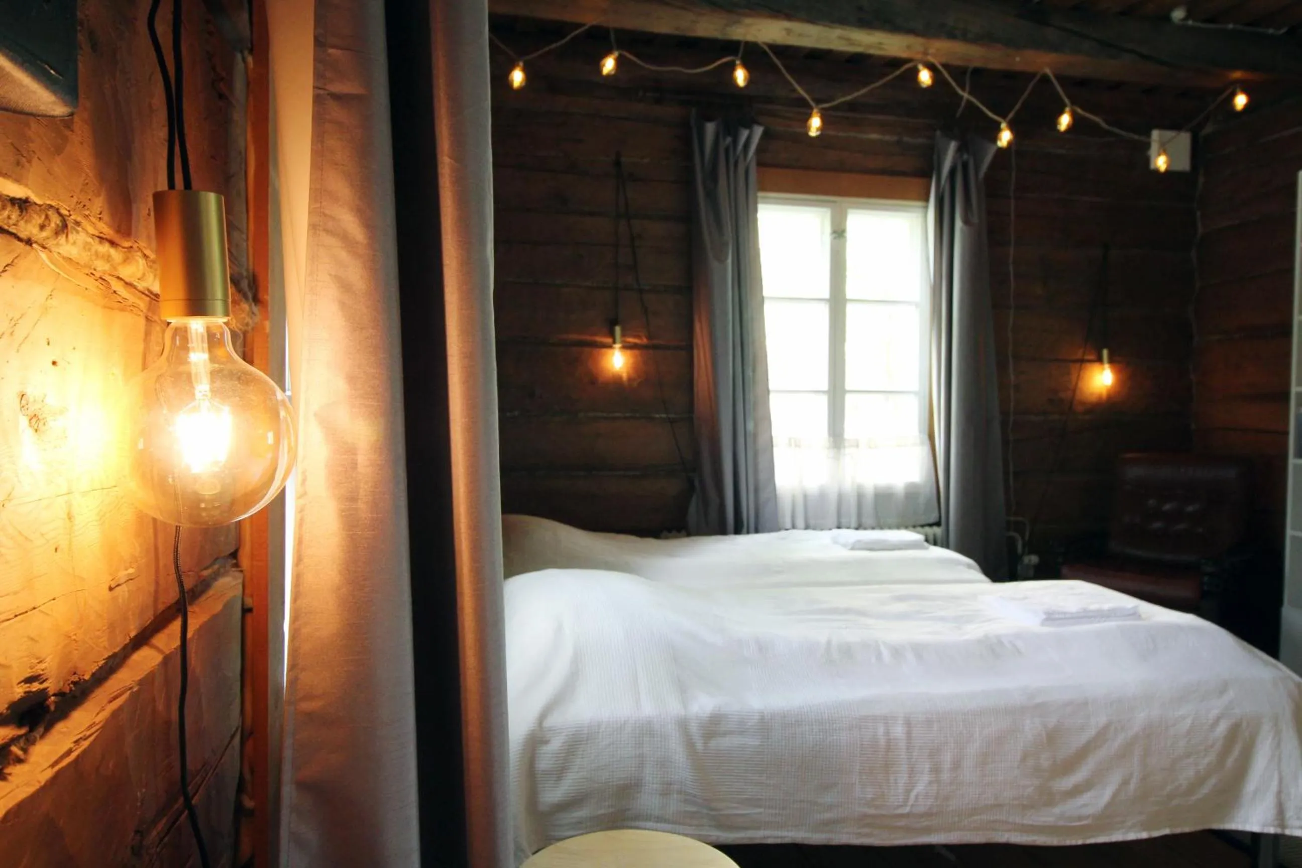 Bed in LAURI Historical Log House Manor