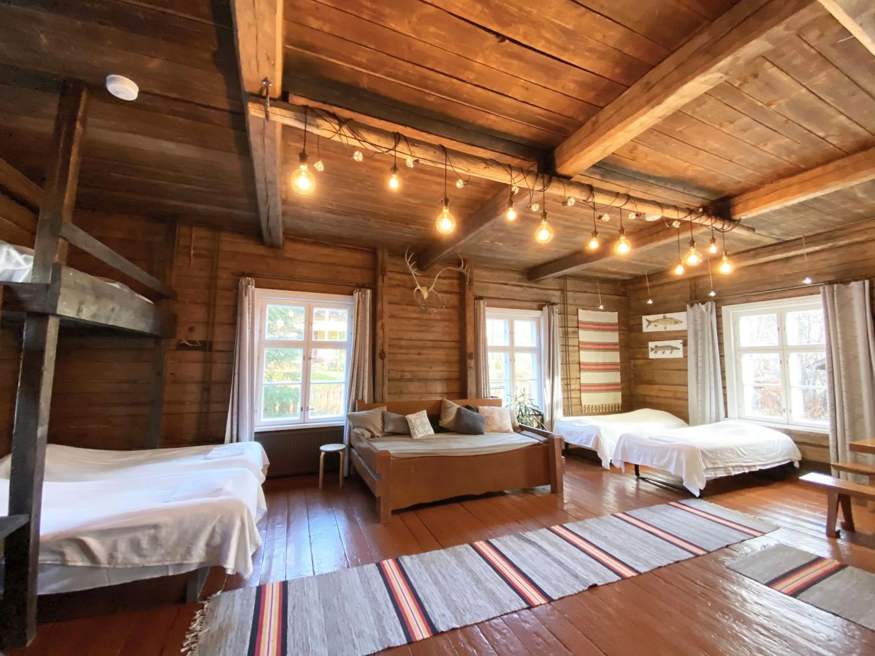 Photo of the whole room, Bed in LAURI Historical Log House Manor
