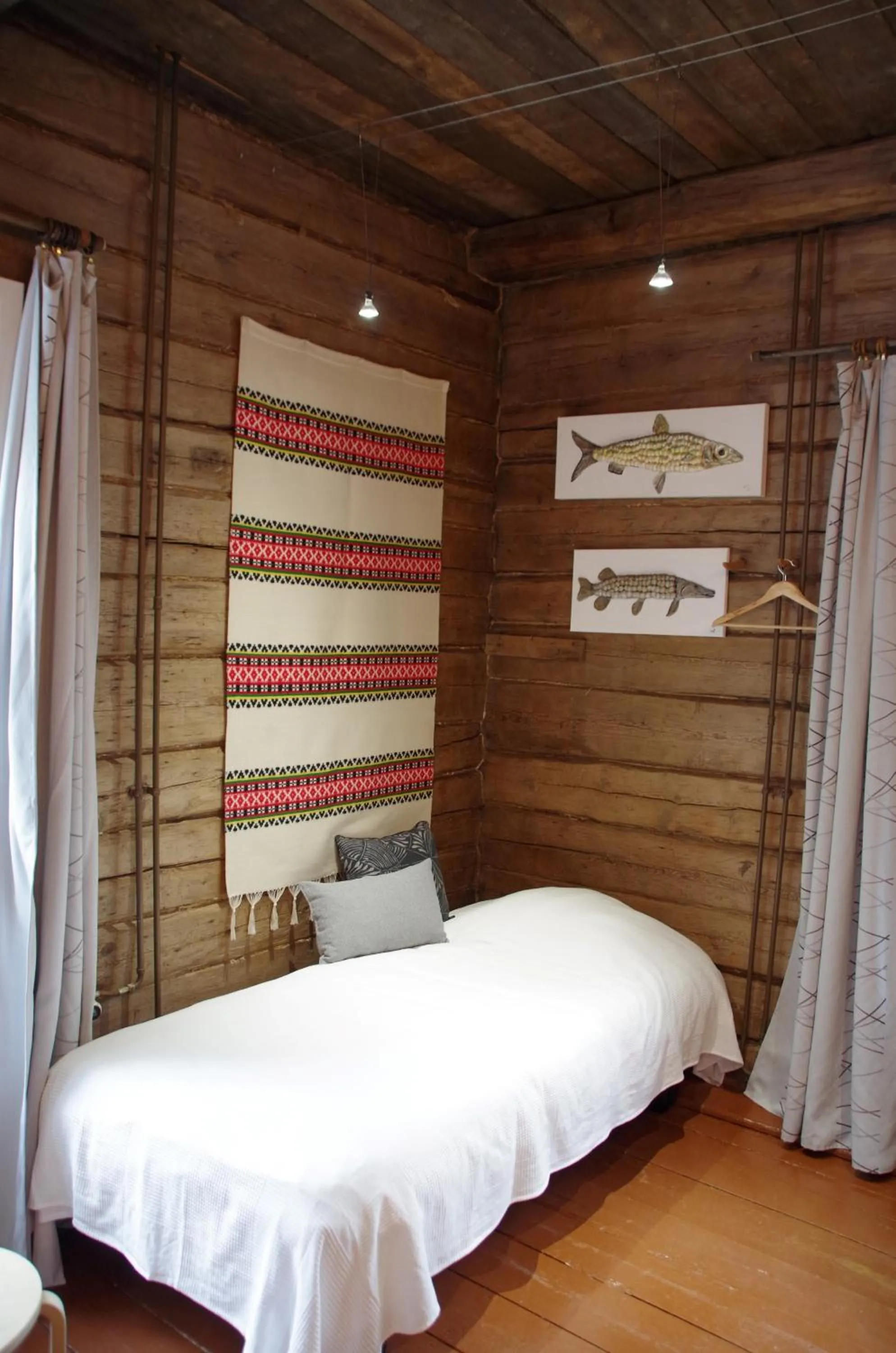 Bed in LAURI Historical Log House Manor