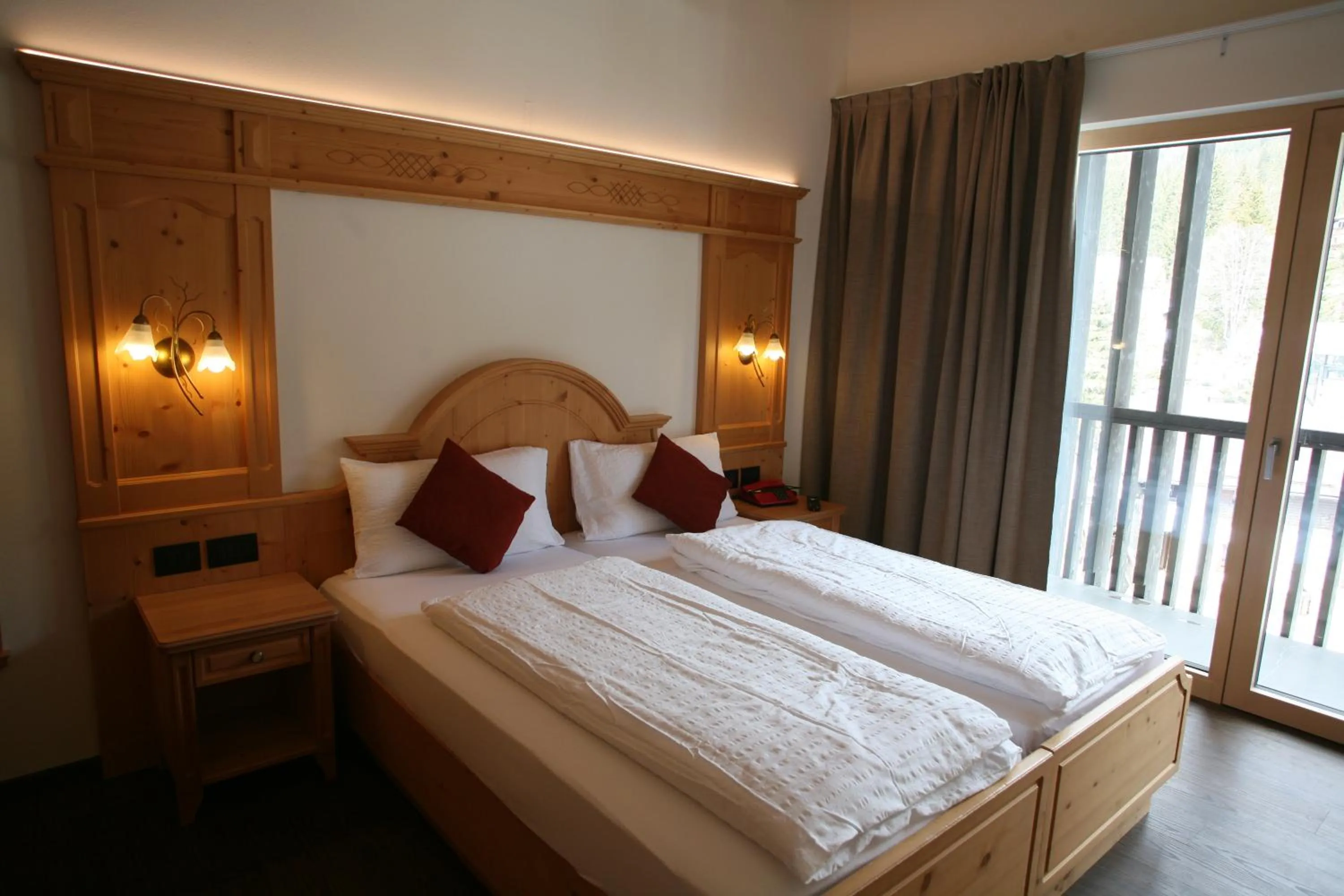 Bed in Alpen Hotel Vidi