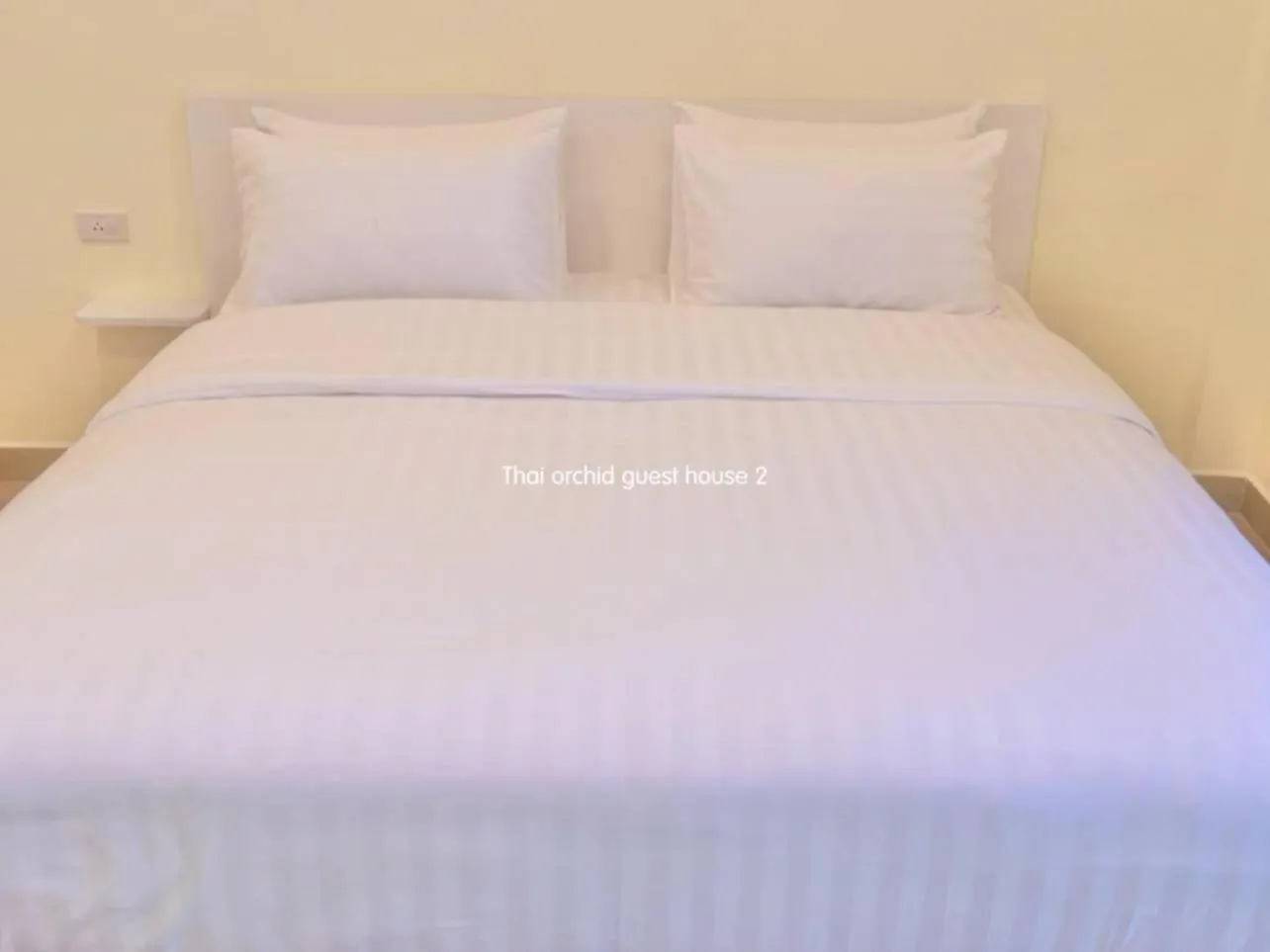 Bed in Thai Orchid Guest House