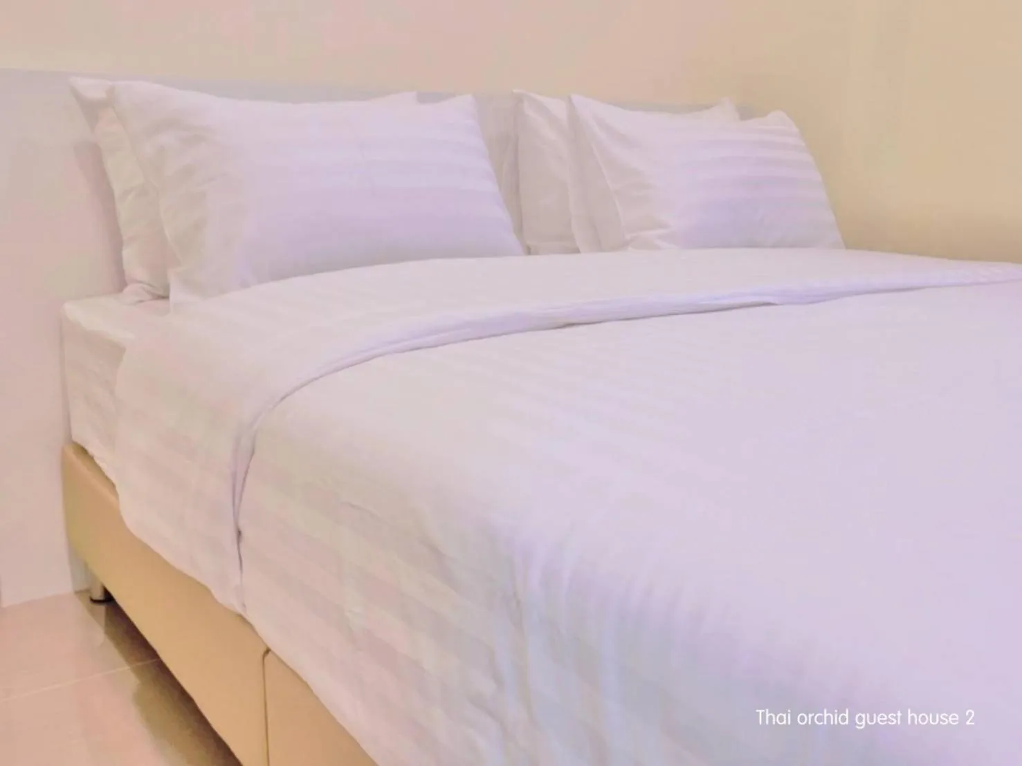 Bed in Thai Orchid Guest House