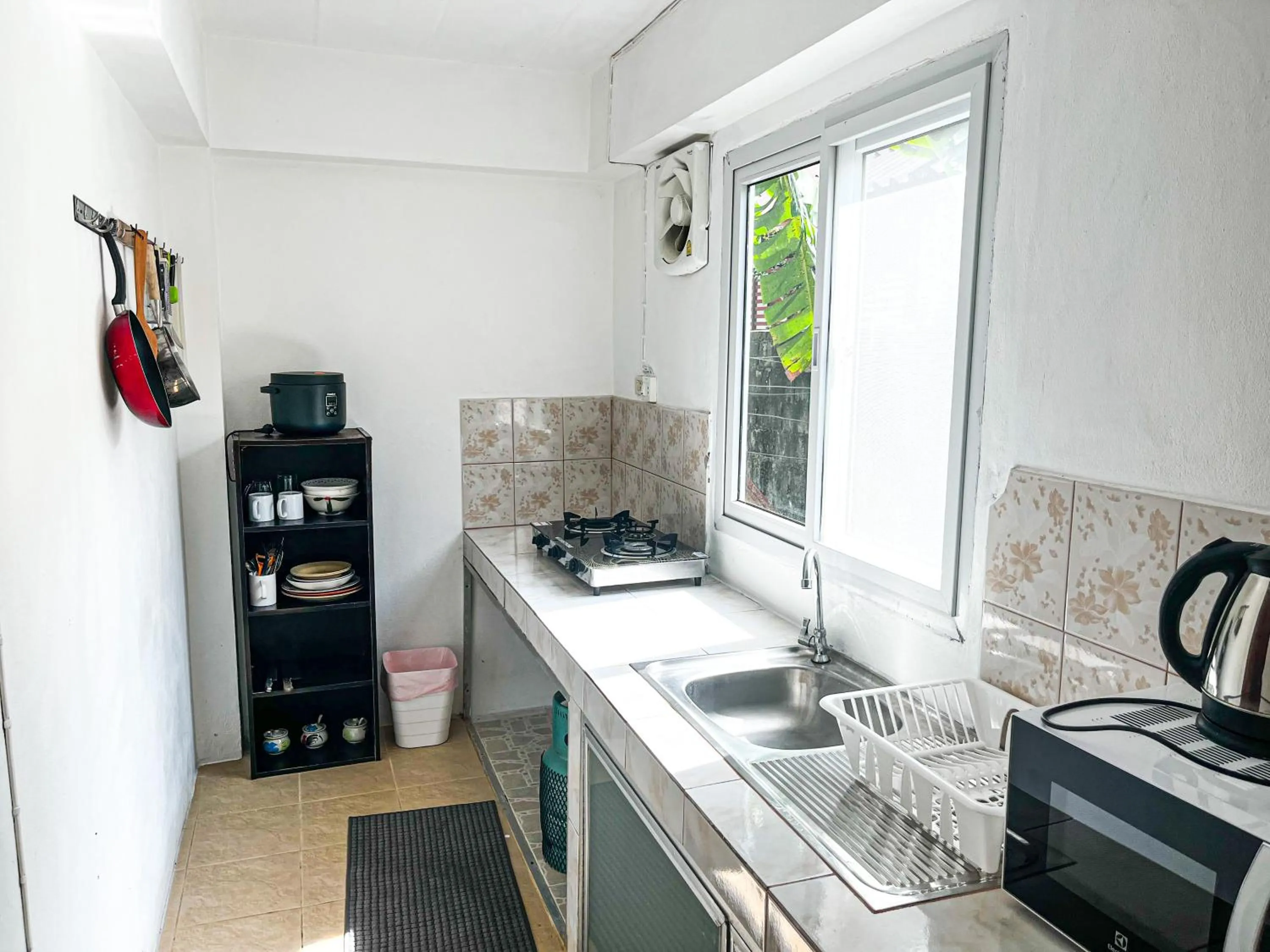 Kitchen or kitchenette in Amy Village Apartments & Digital Hub