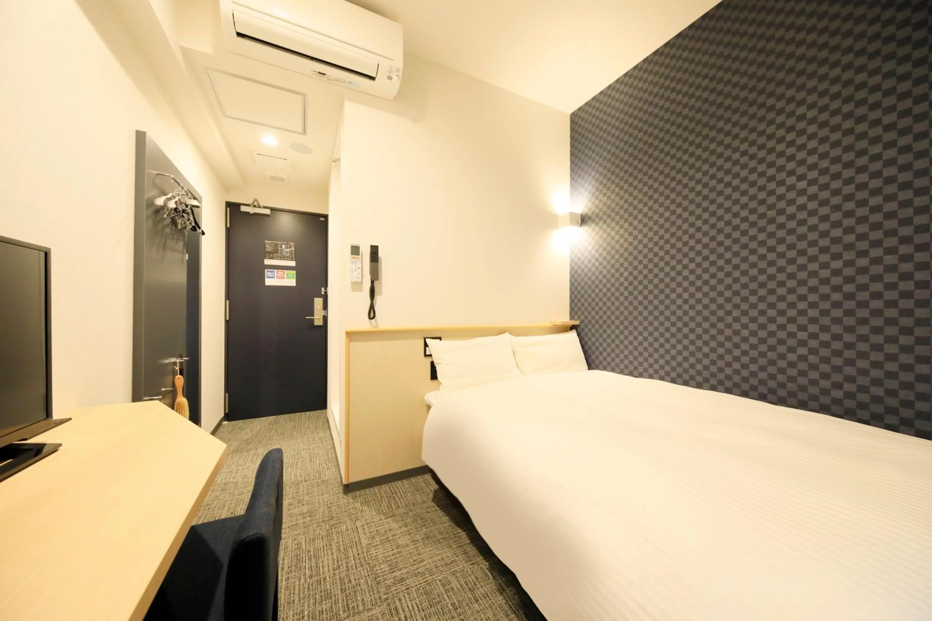 Bed in Hotel NewNagano NeXT