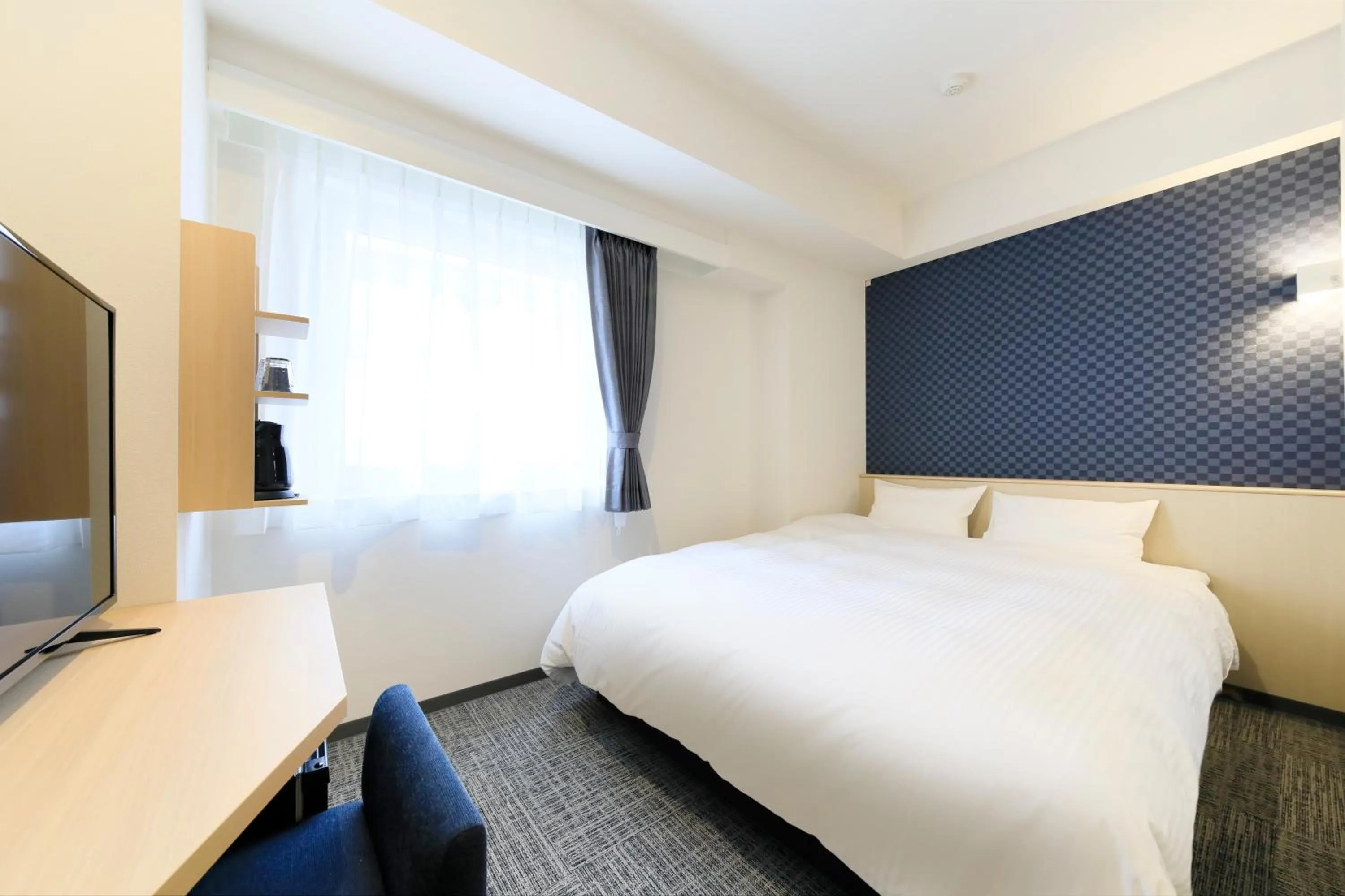 Bed in Hotel NewNagano NeXT