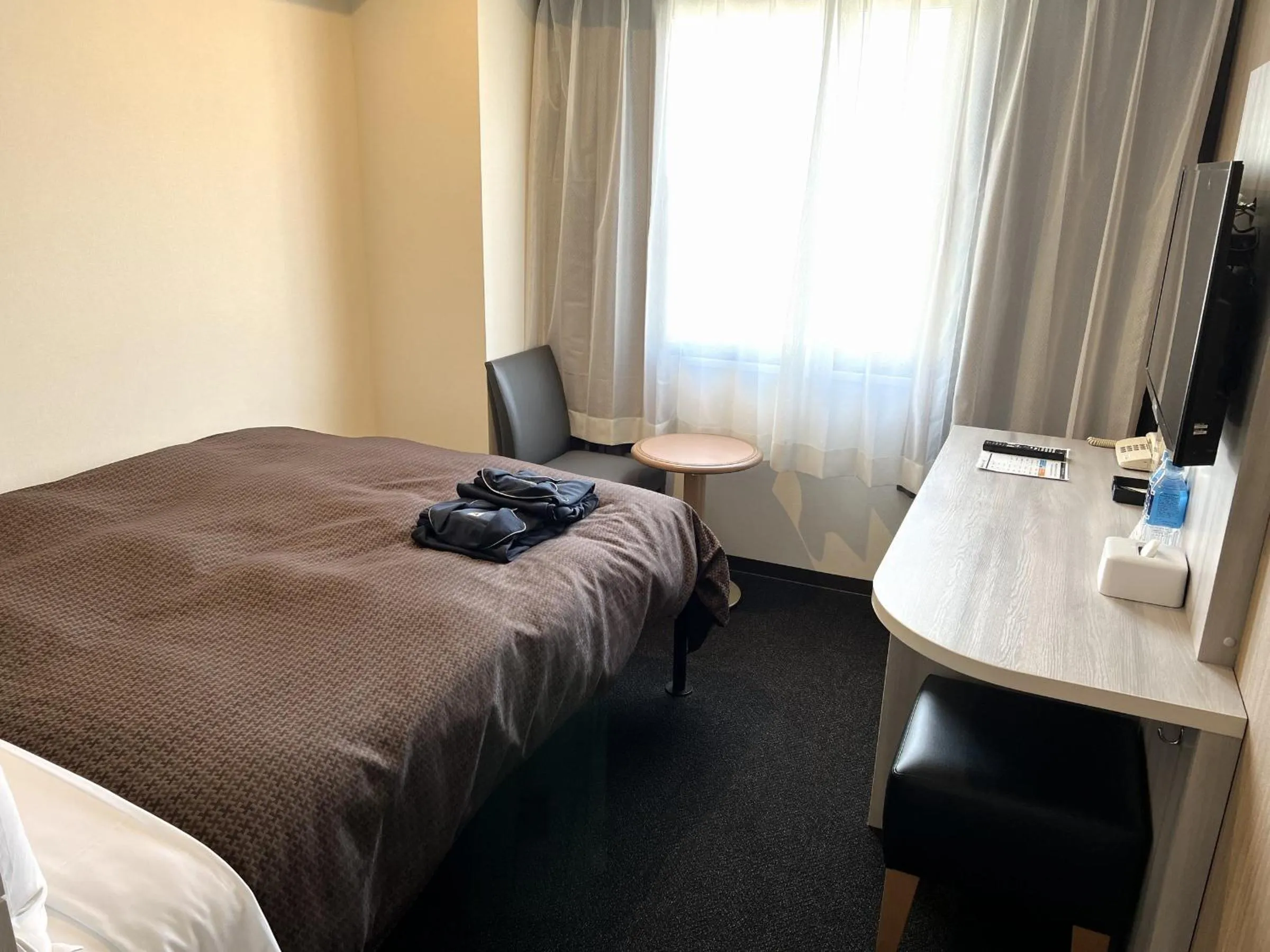 Bed in Sunwest Hotel Sasebo