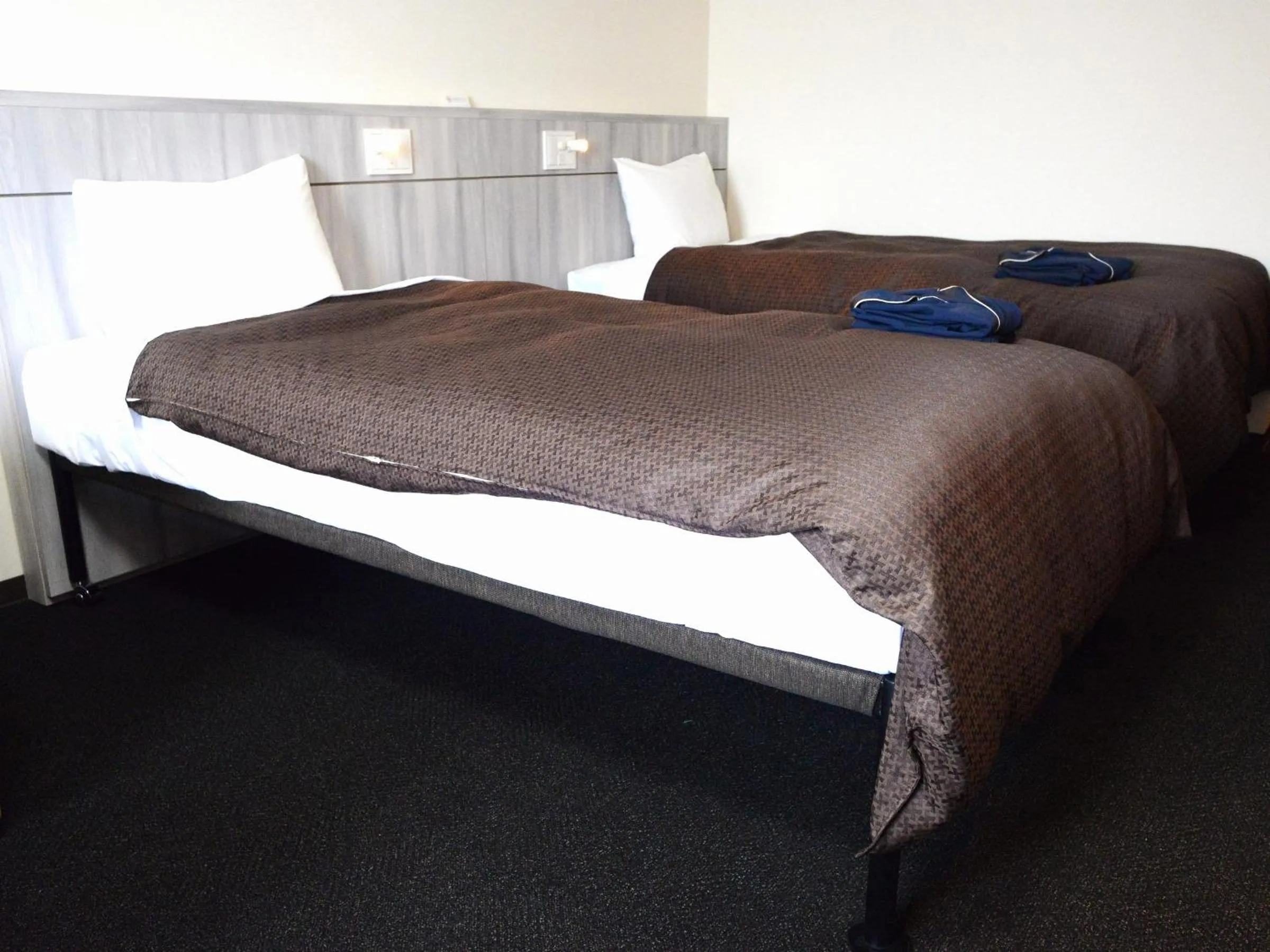 Bed in Sunwest Hotel Sasebo