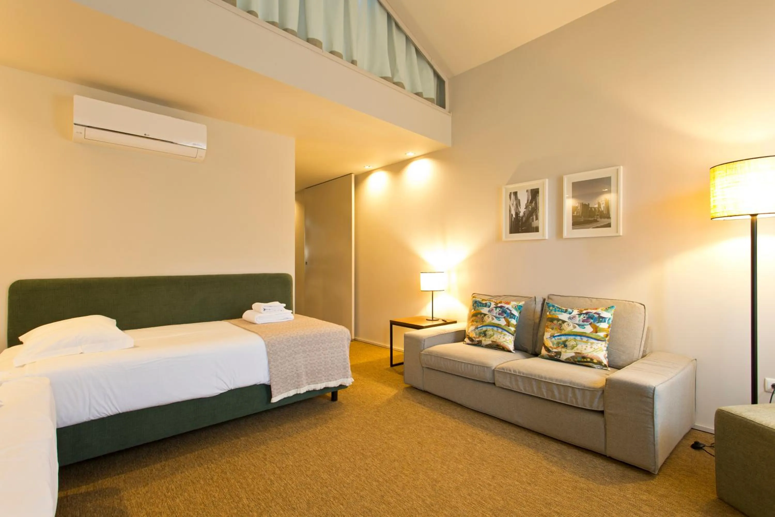 Living room, Bed in RVA - Gustave Eiffel Apartments