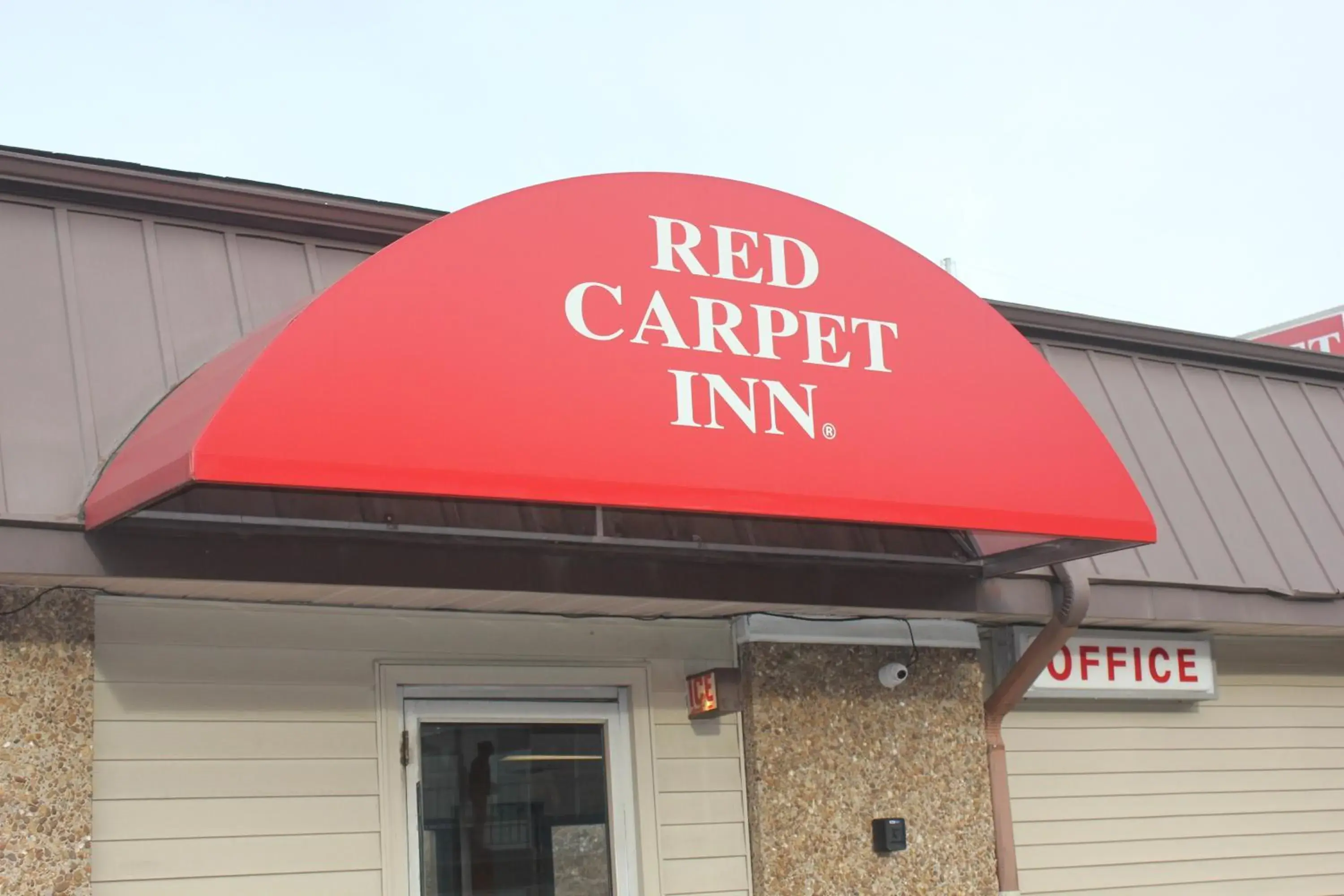 Property logo or sign in Red Carpet Inn - Louisville