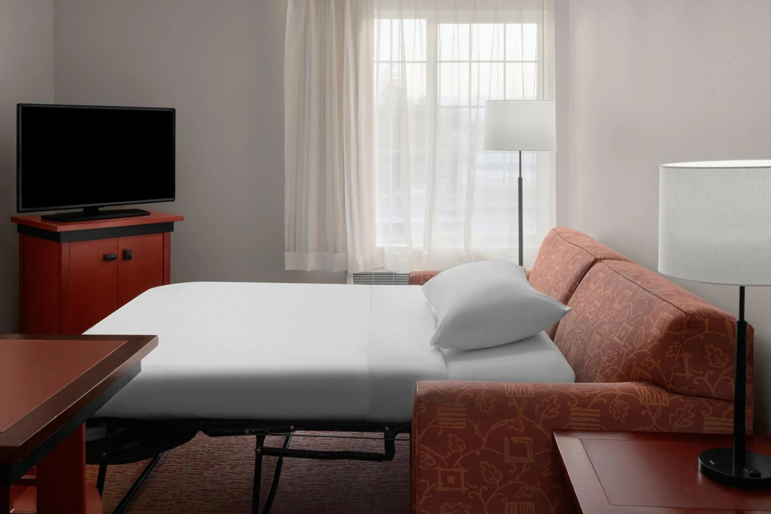 Bed in Larkspur Landing Extended Stay Suites Campbell