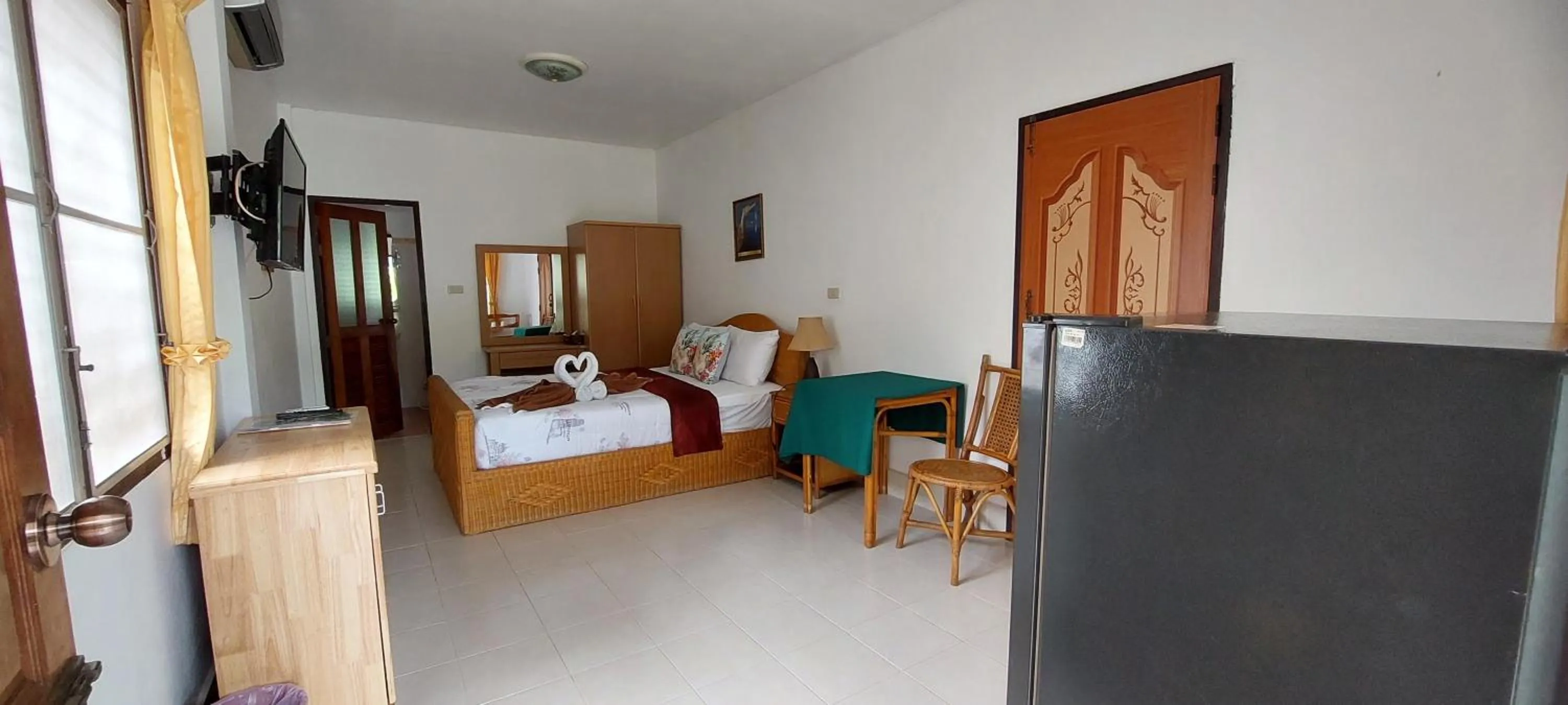 Bed in Jungle Village Bungalow