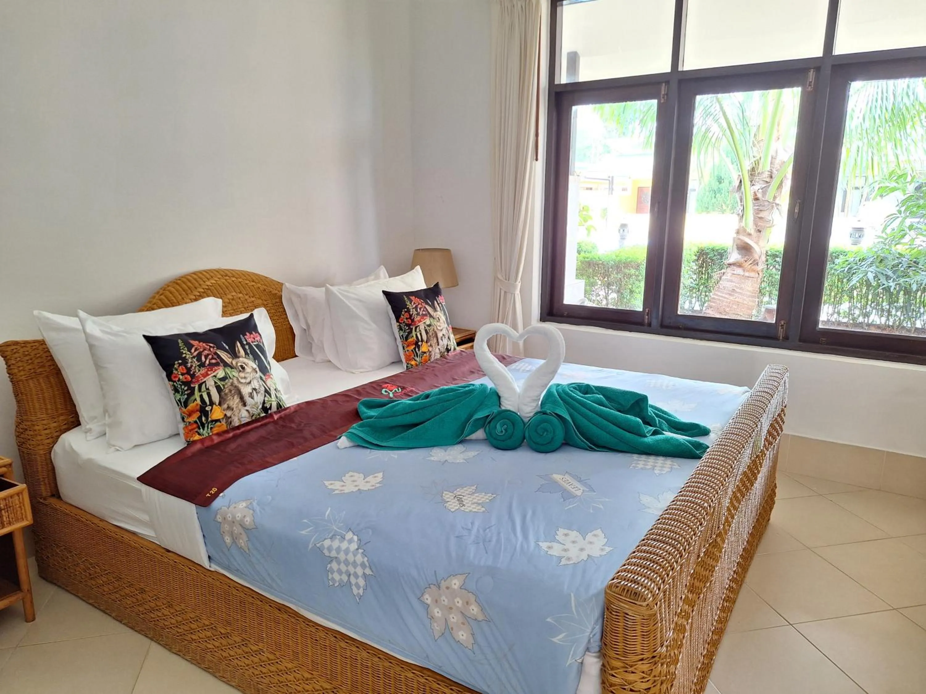 Bed in Jungle Village Bungalow