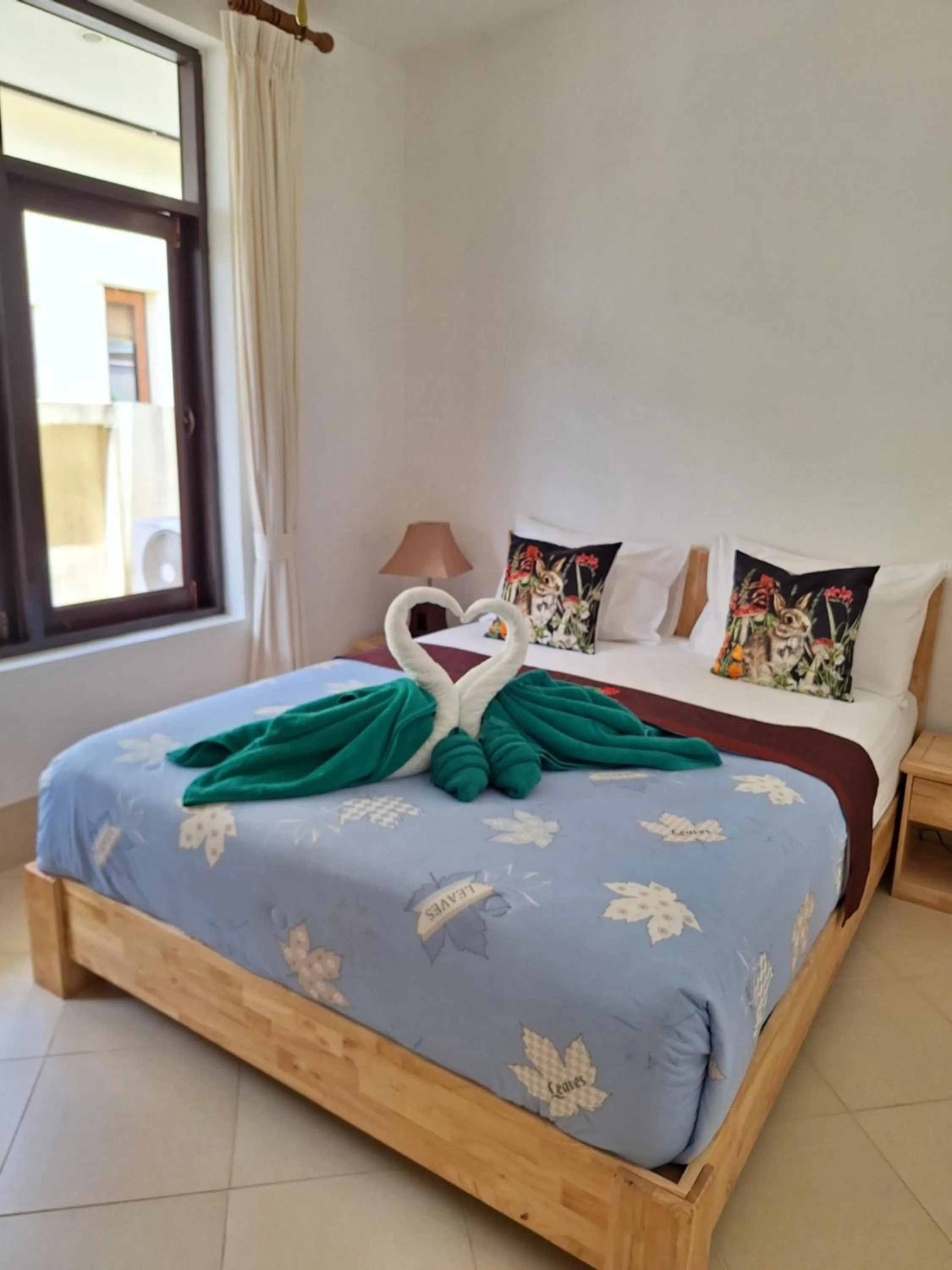 Bed in Jungle Village Bungalow