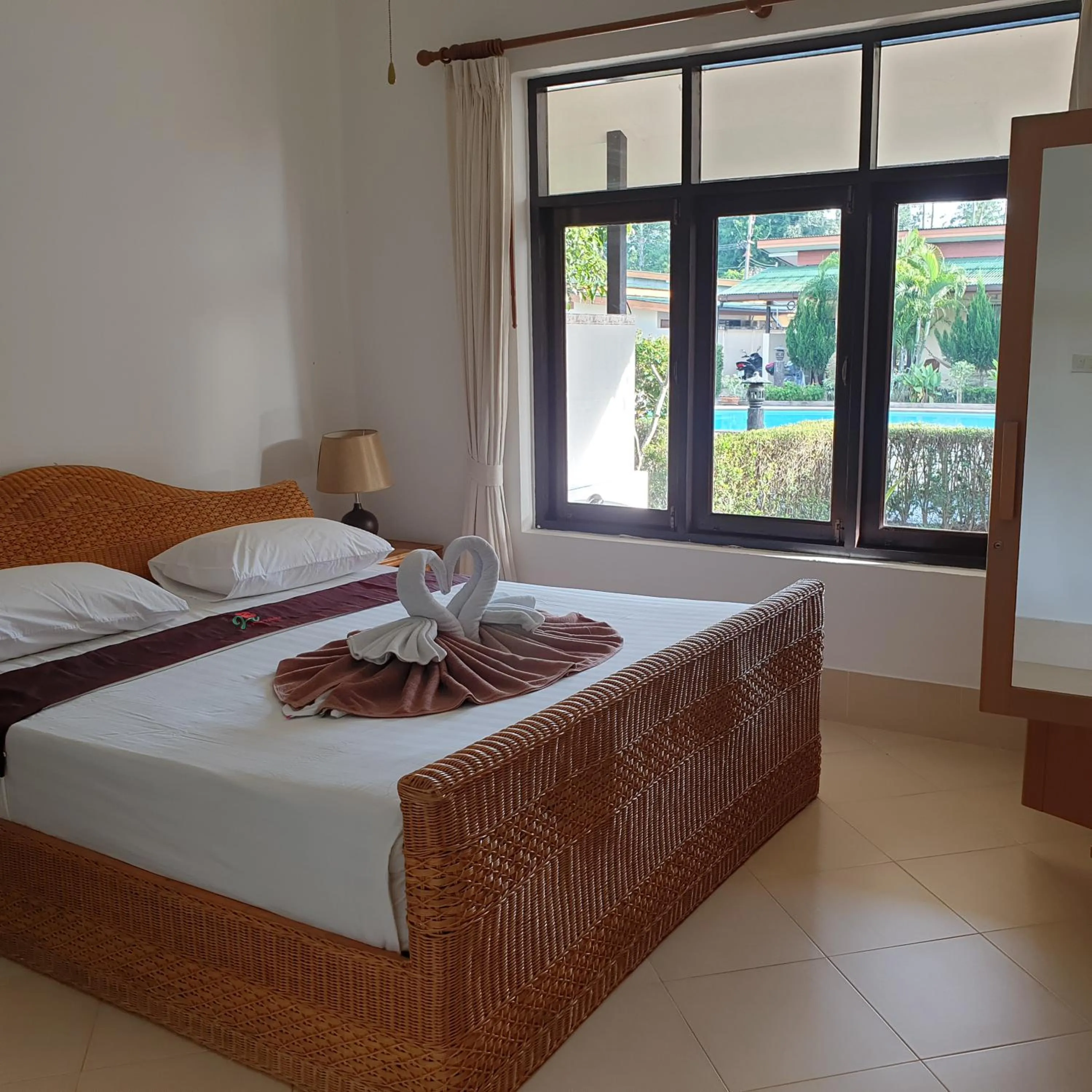 Bed in Jungle Village Bungalow