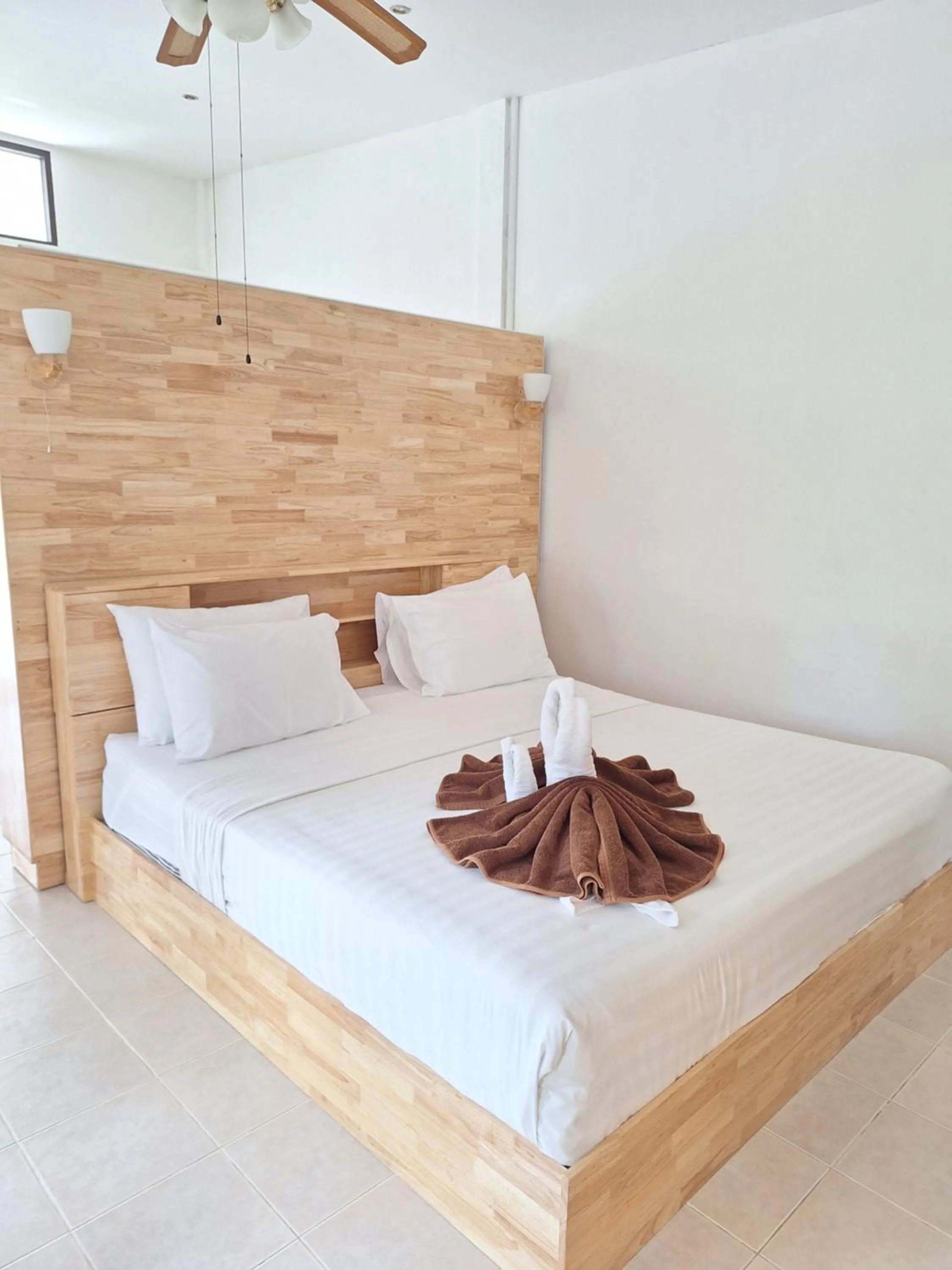 Bed in Jungle Village Bungalow