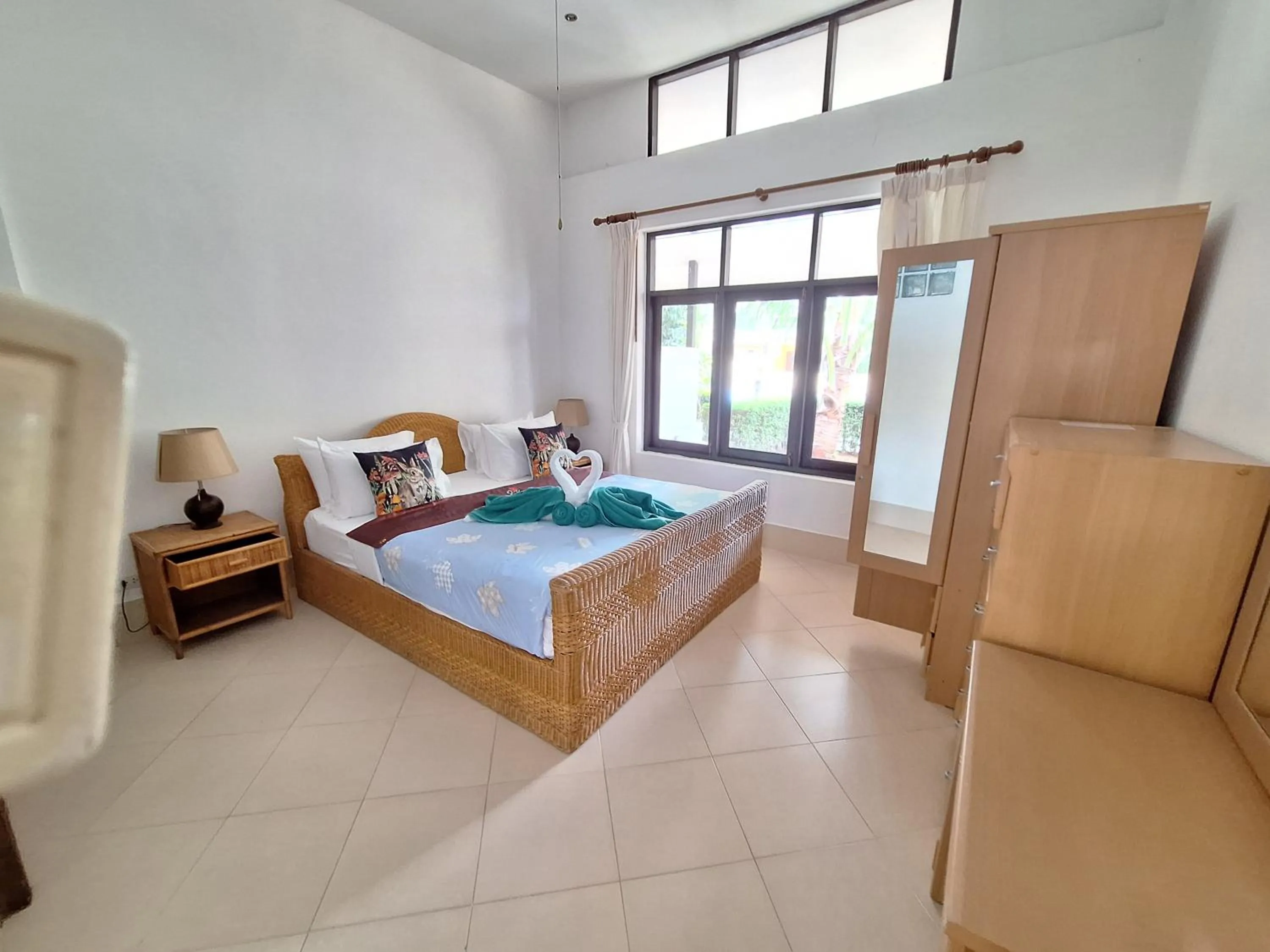 Bed in Jungle Village Bungalow