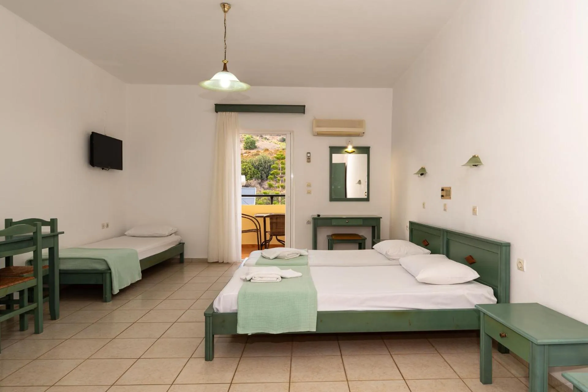 Bed in Elpis Studio Apartments