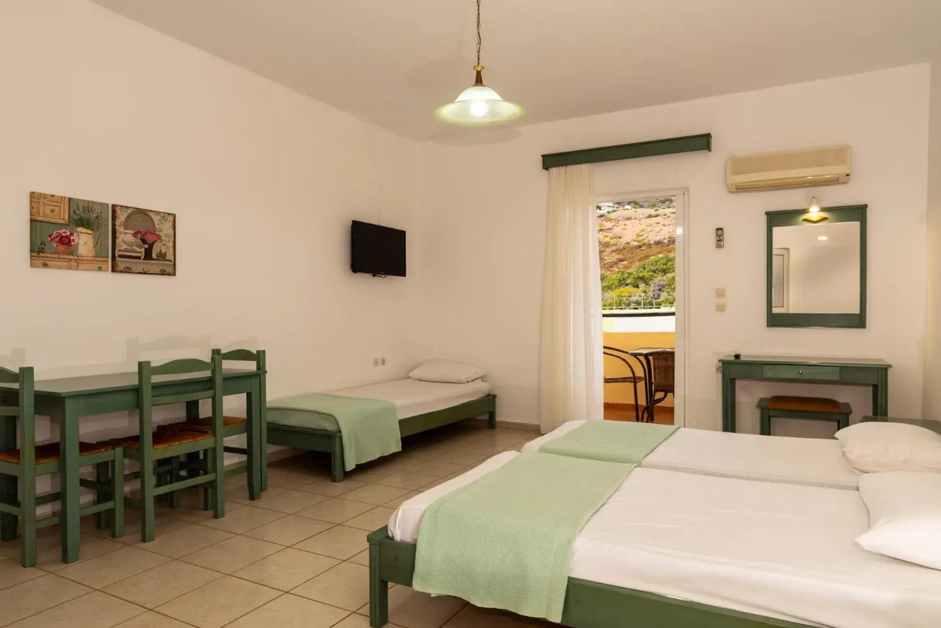 Bed in Elpis Studio Apartments Bed in Elpis Studio Apartments