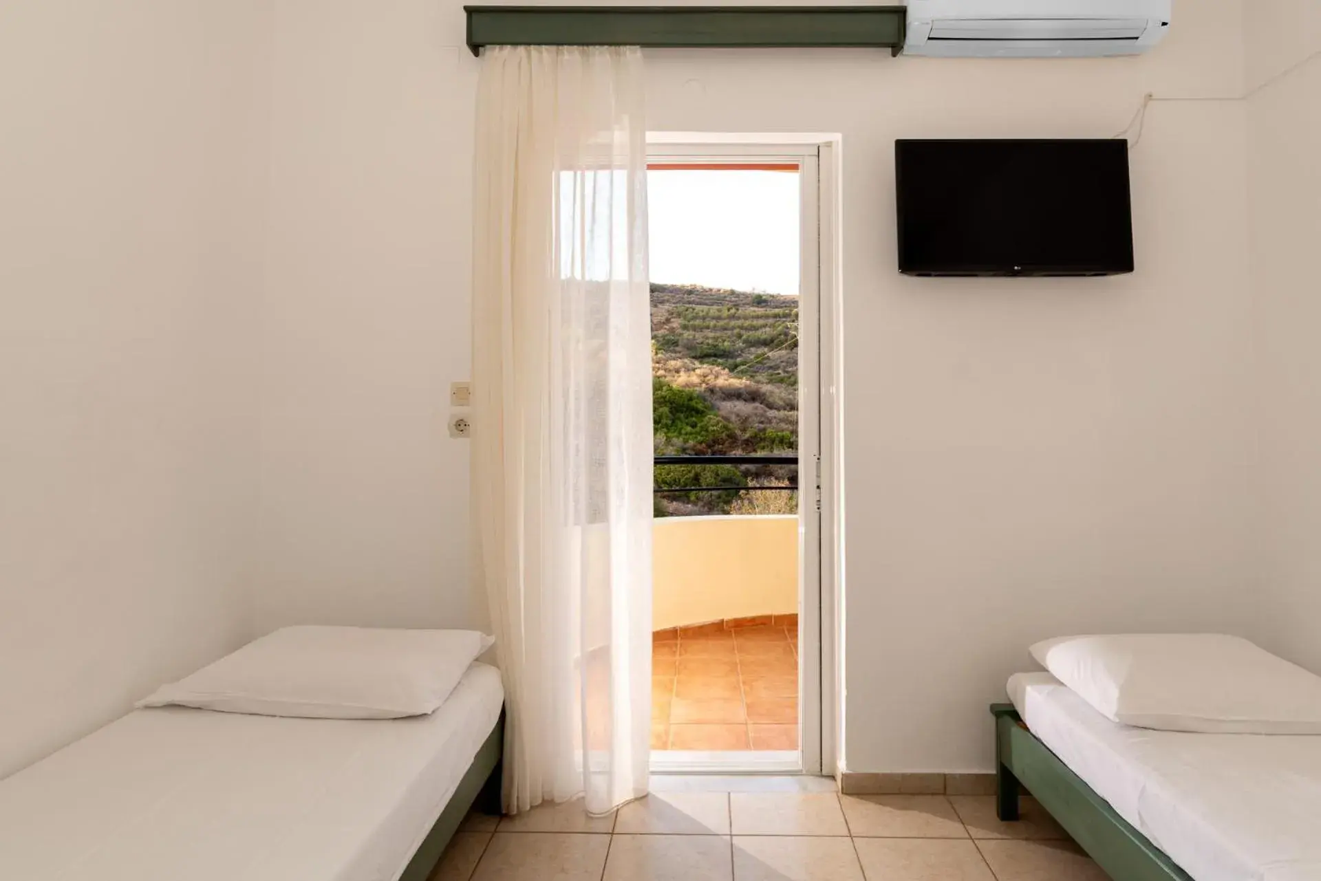 Bed in Elpis Studio Apartments Bed in Elpis Studio Apartments