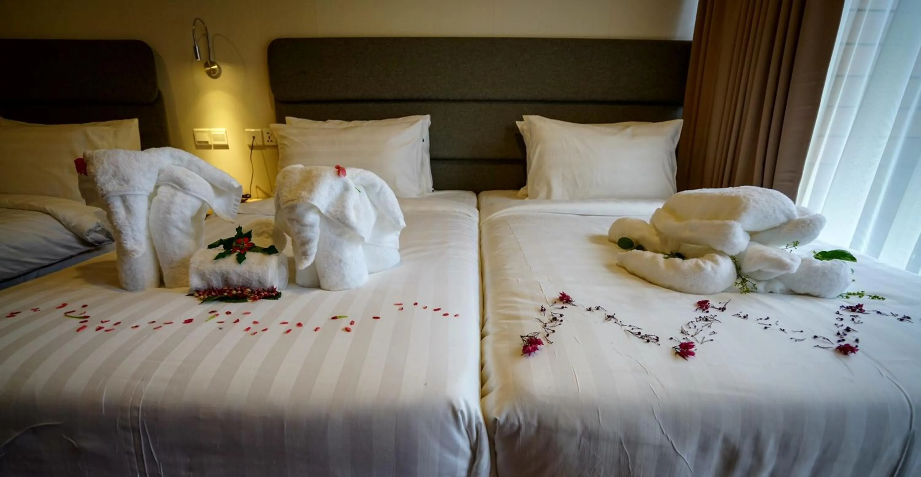 Bed in Aman Tioman Beach Resort