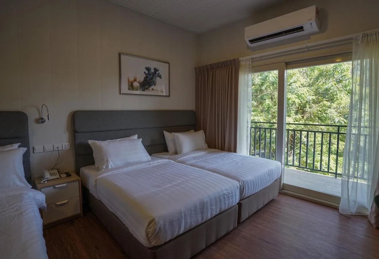 Bed in Aman Tioman Beach Resort