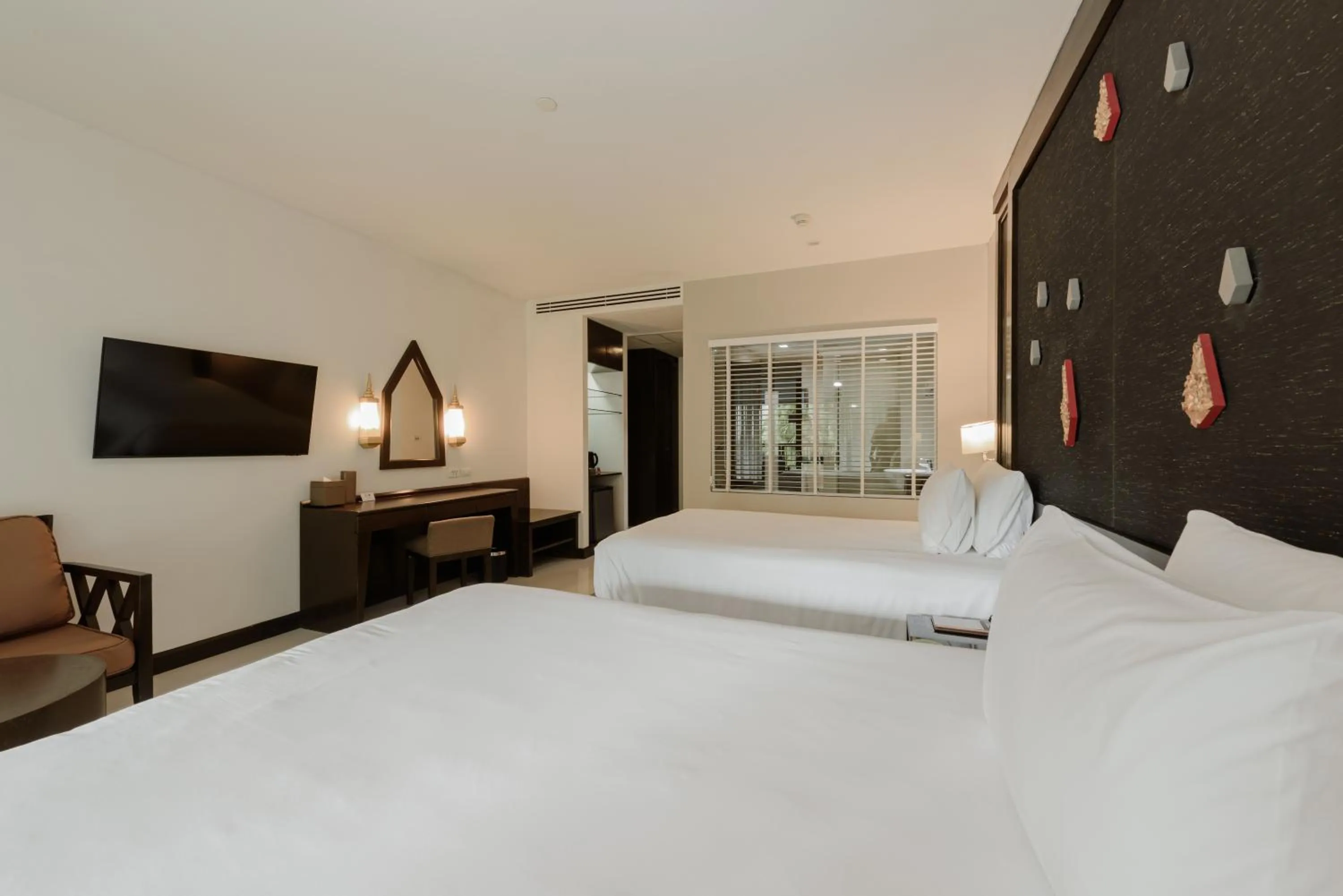 Bed in Centara Anda Dhevi Resort & Spa Krabi