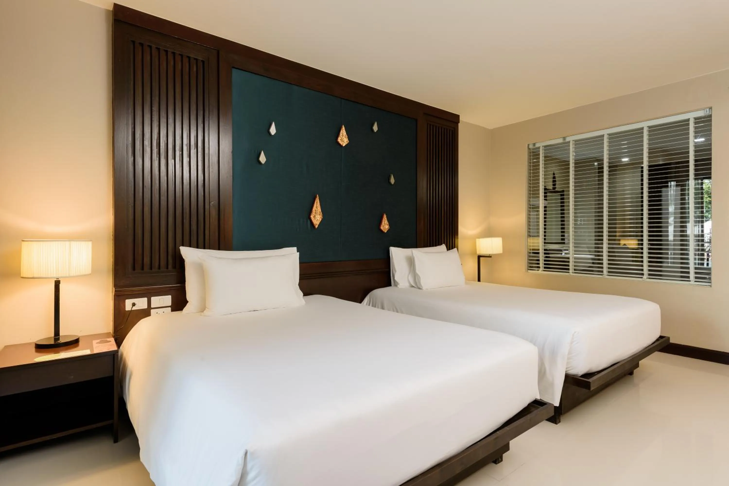 Bed in Centara Anda Dhevi Resort & Spa Krabi