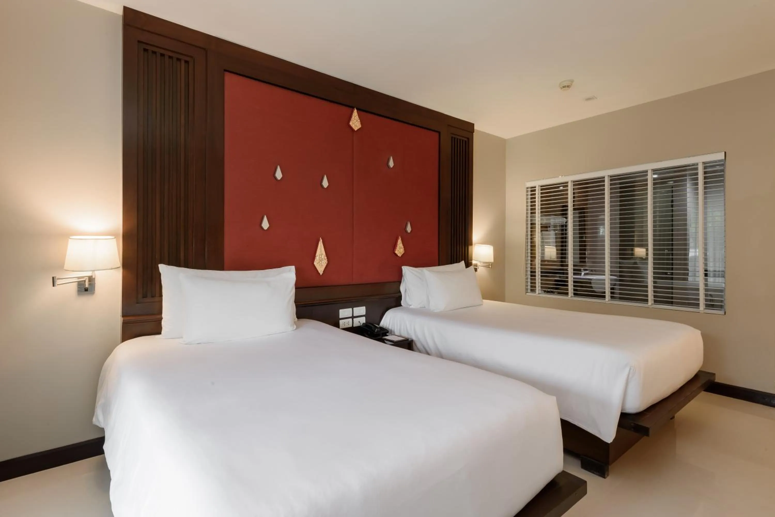 Bed in Centara Anda Dhevi Resort & Spa Krabi