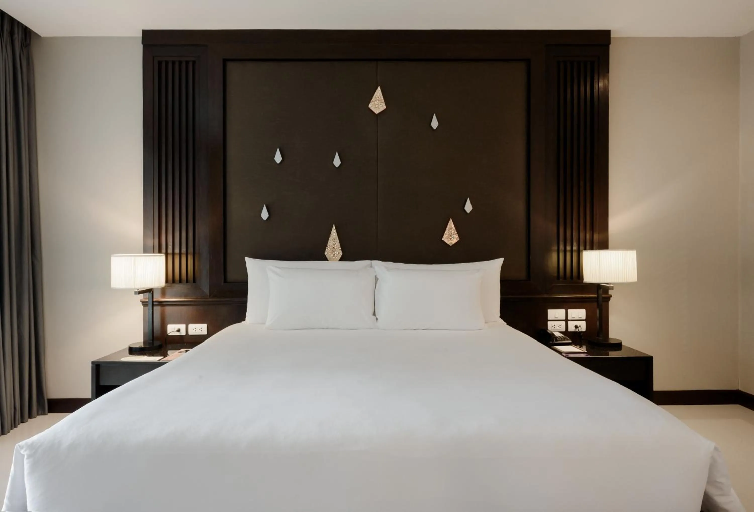 Bed in Centara Anda Dhevi Resort & Spa Krabi