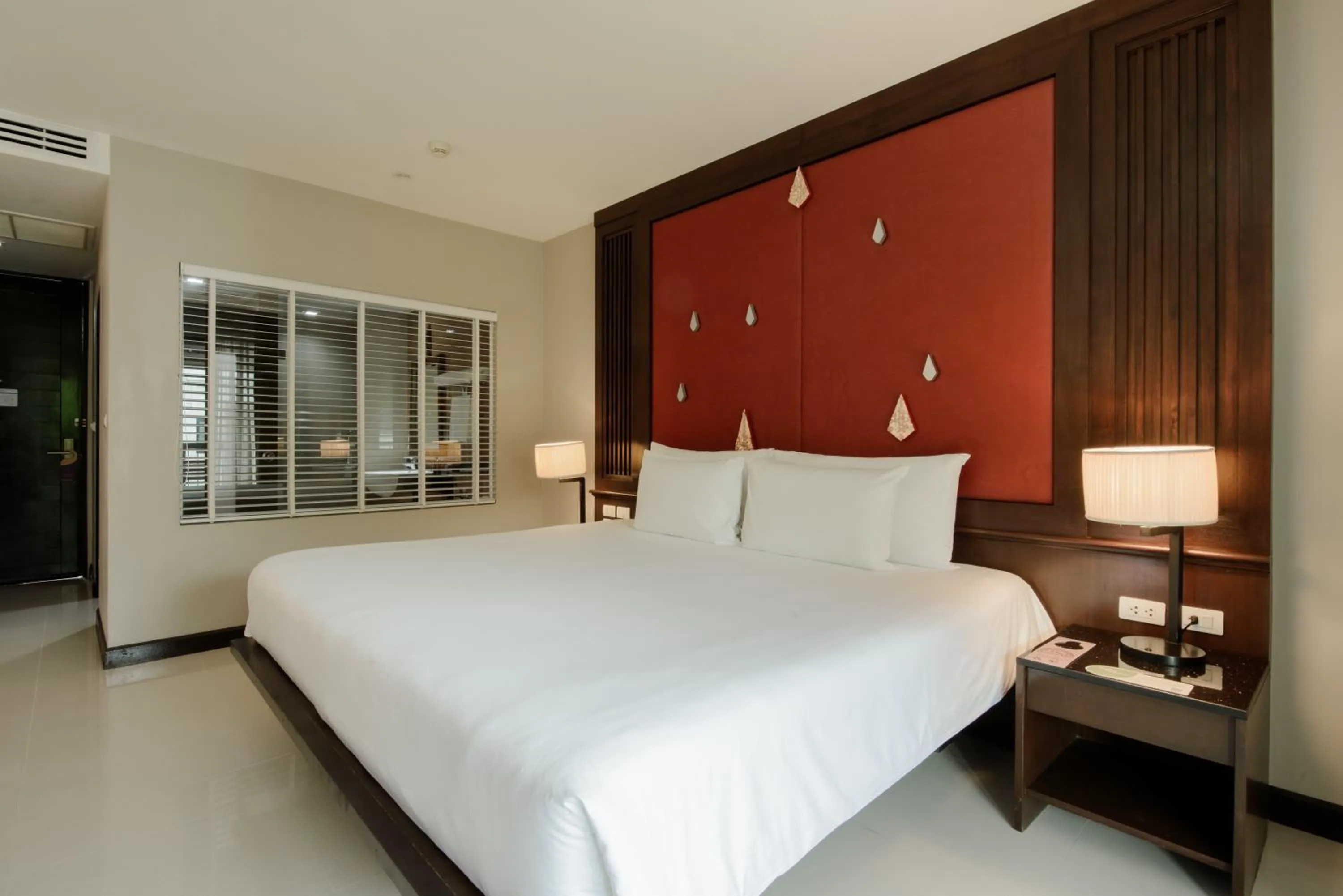 Bed in Centara Anda Dhevi Resort & Spa Krabi