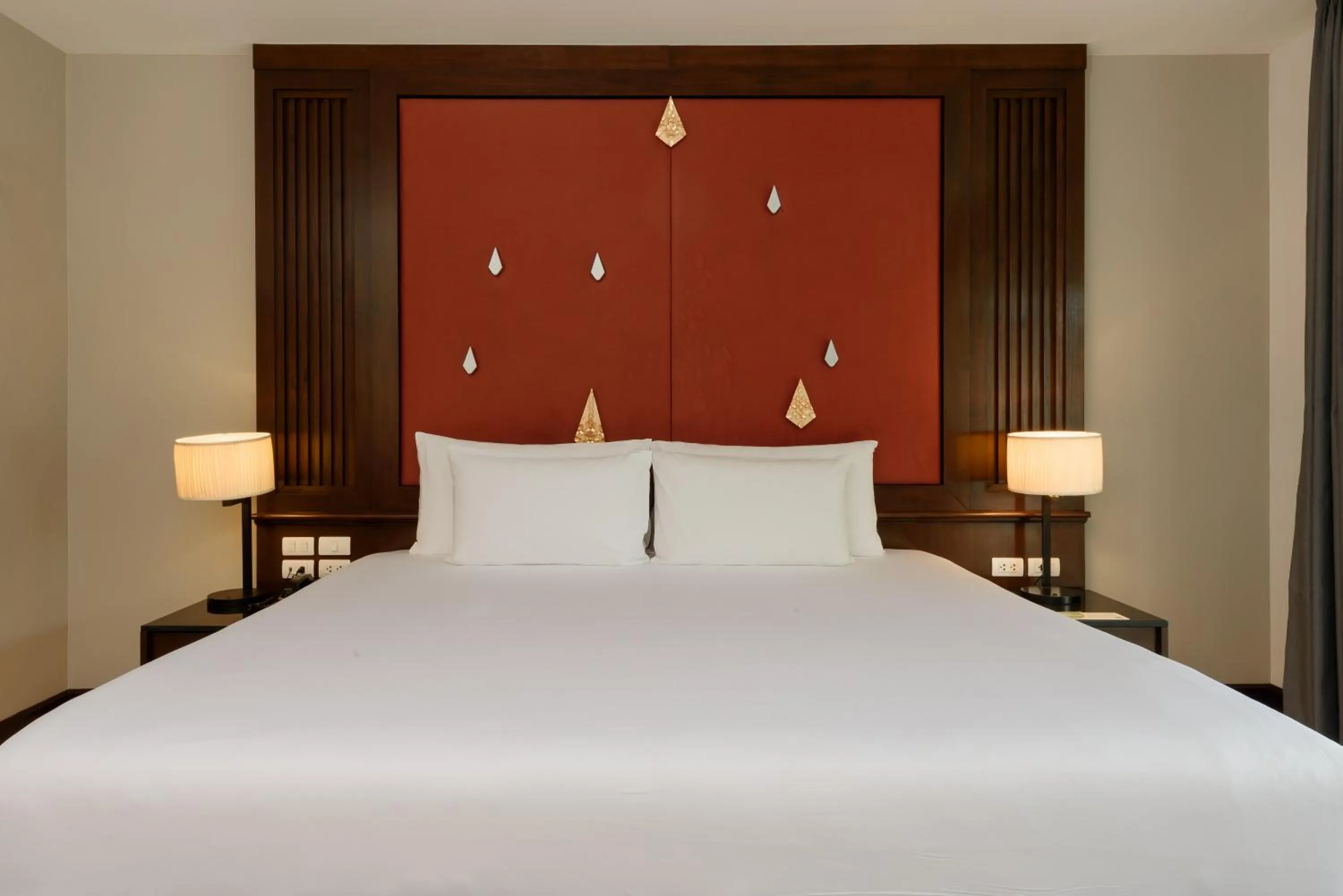 Bed in Centara Anda Dhevi Resort & Spa Krabi