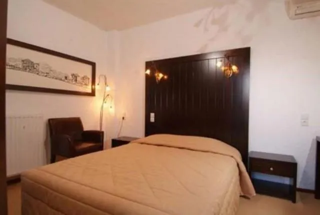 Bed in Hotel Taxiarches