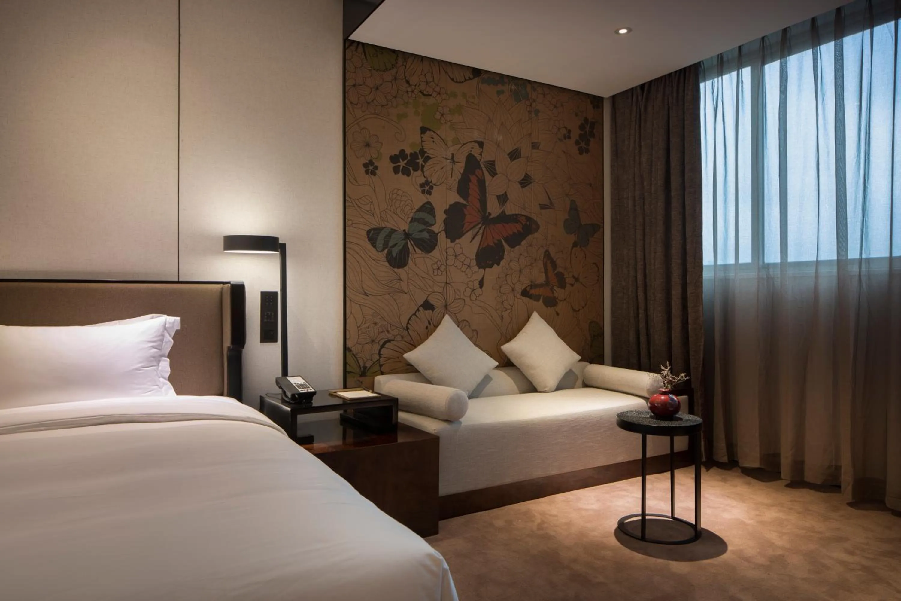 Decorative detail, Bed in Paco Hotel Chebeinan Metro Guanghzou