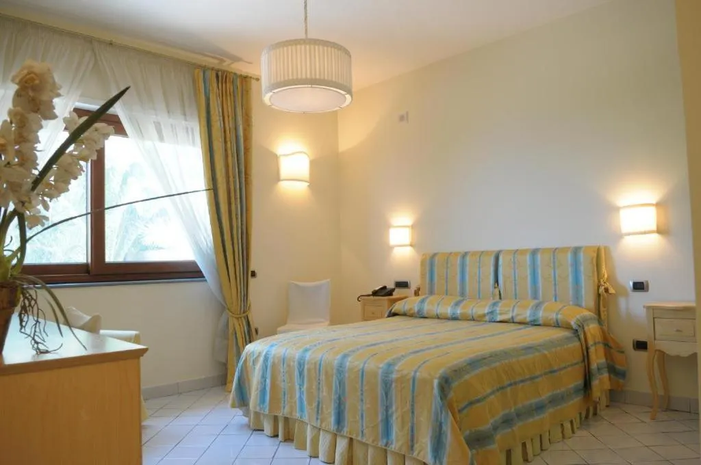 Bed in Villa Poseidon -Boutique Hotel-