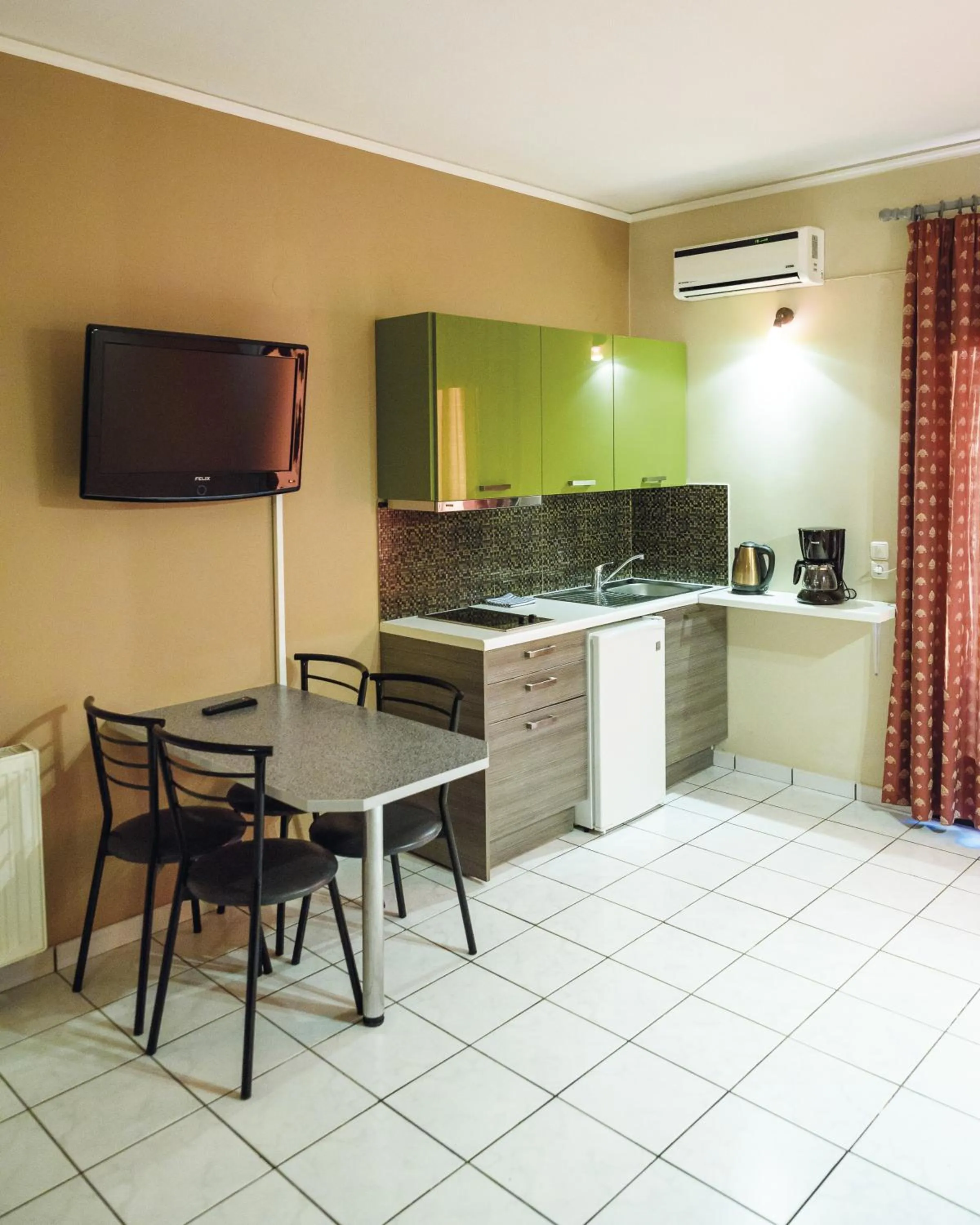 Kitchen or kitchenette in Sun Village Hotel Apartments