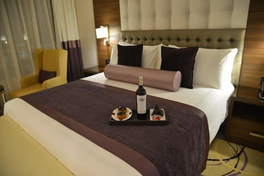 Bed in The Envoy Hotel Abuja