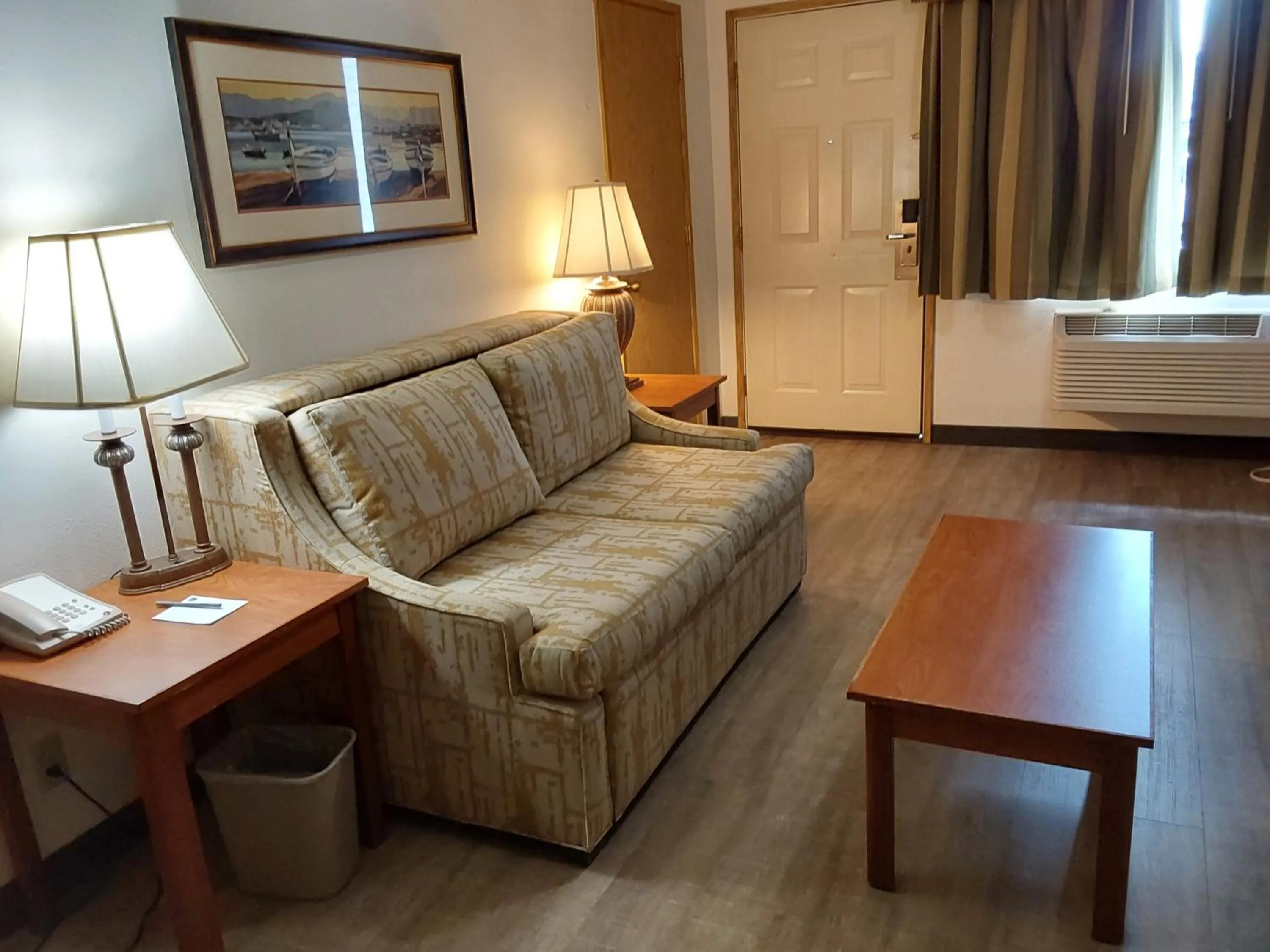 Seating area, Bed in Lavissh inn and Suites