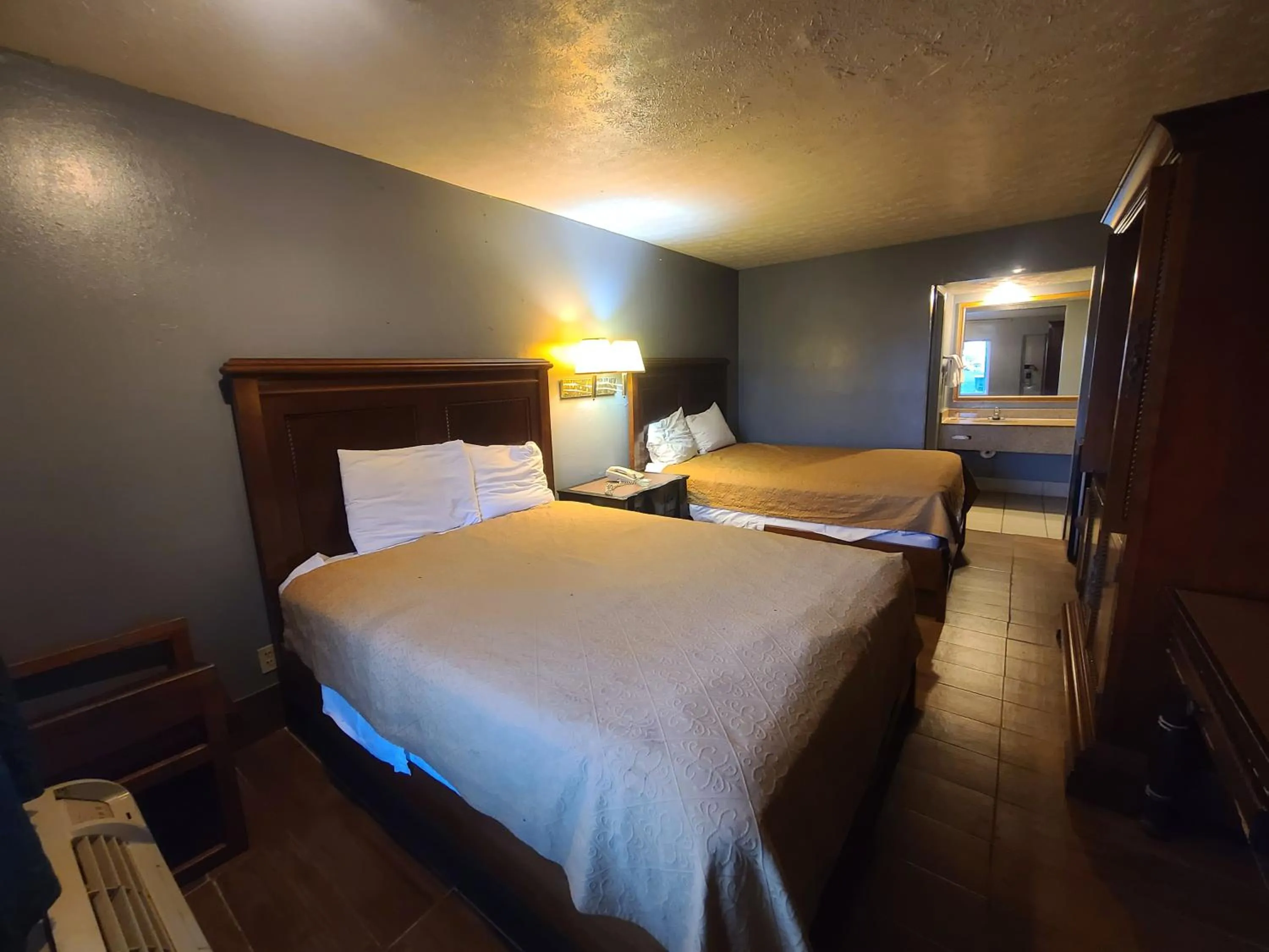 Bed in Garden Inn and Extended Stay