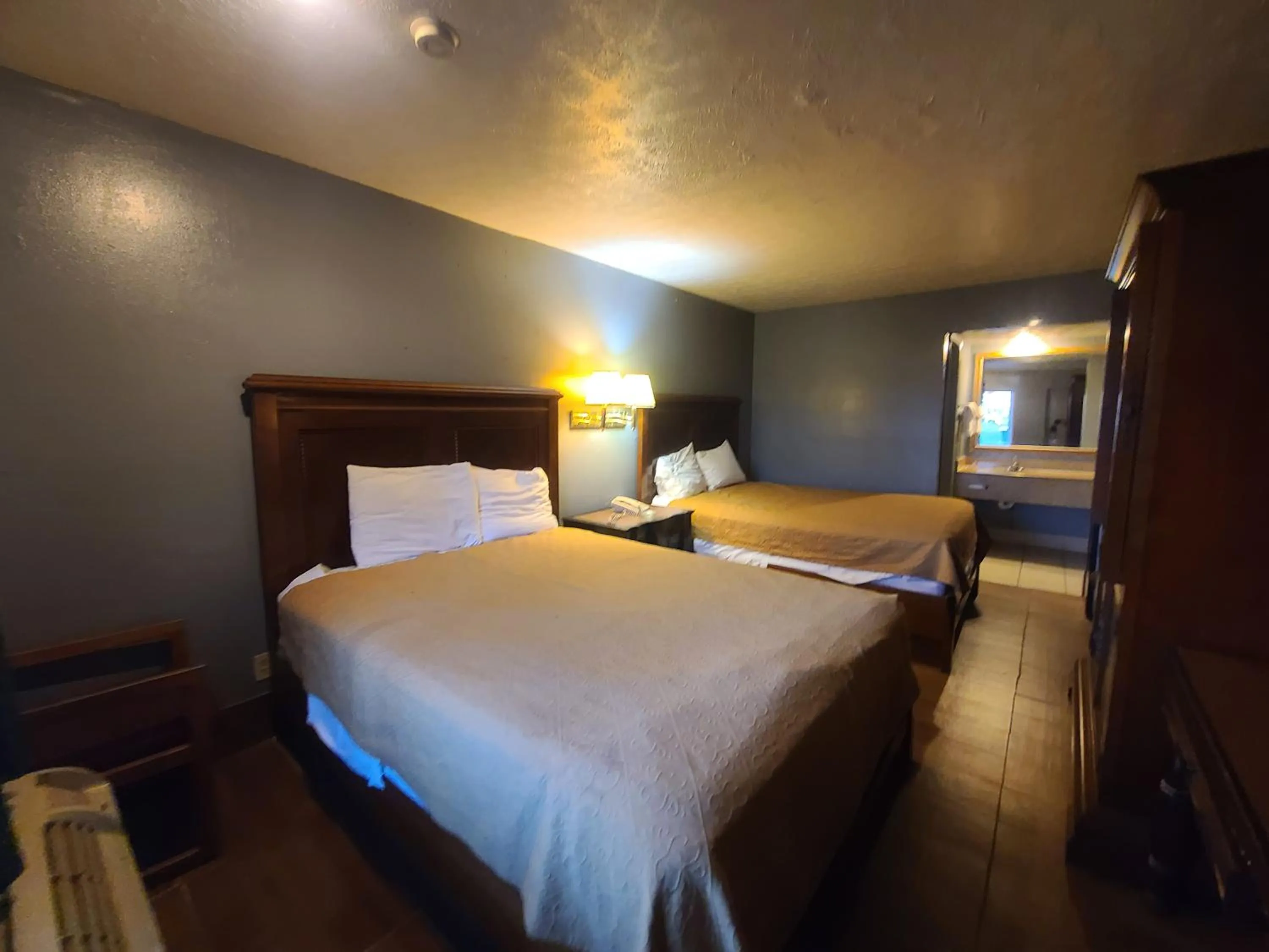 Bed in Garden Inn and Extended Stay