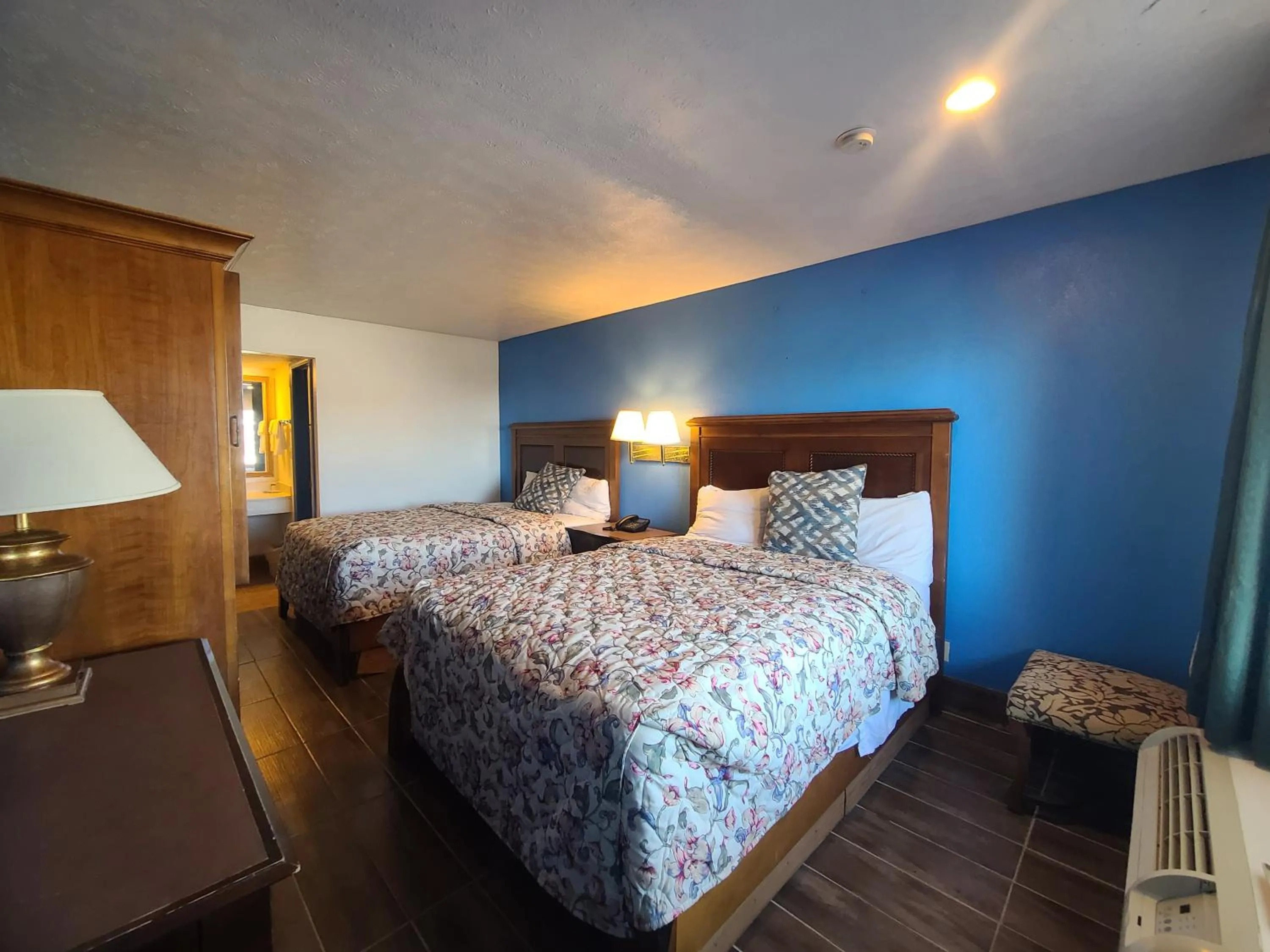 Bed in Garden Inn and Extended Stay