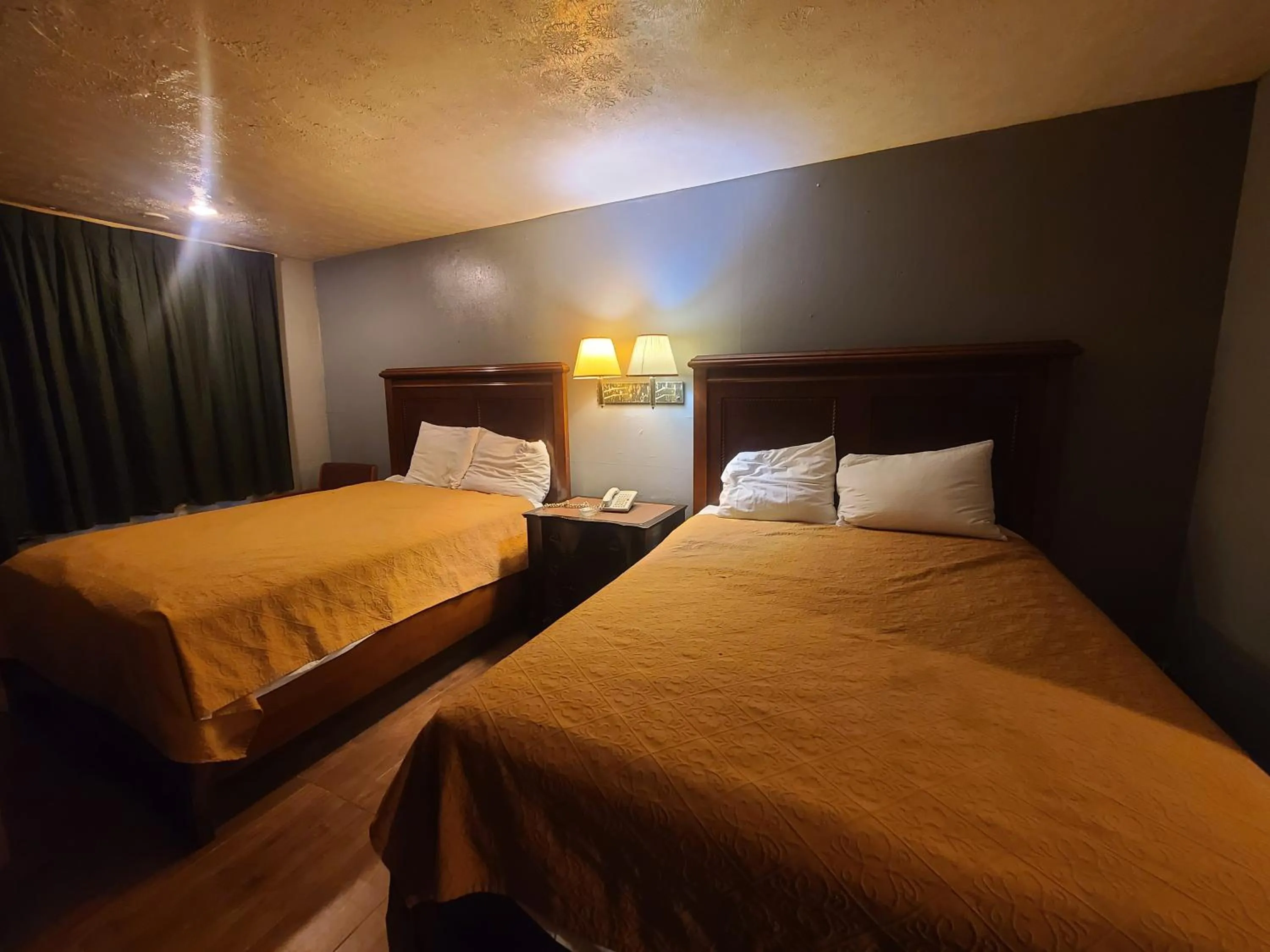 Bed in Garden Inn and Extended Stay