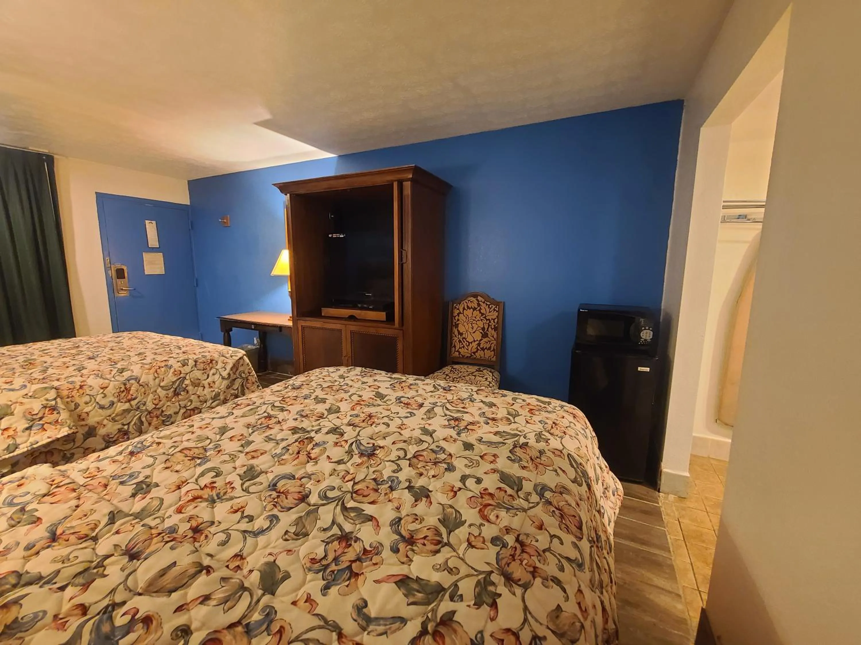 Bed in Garden Inn and Extended Stay