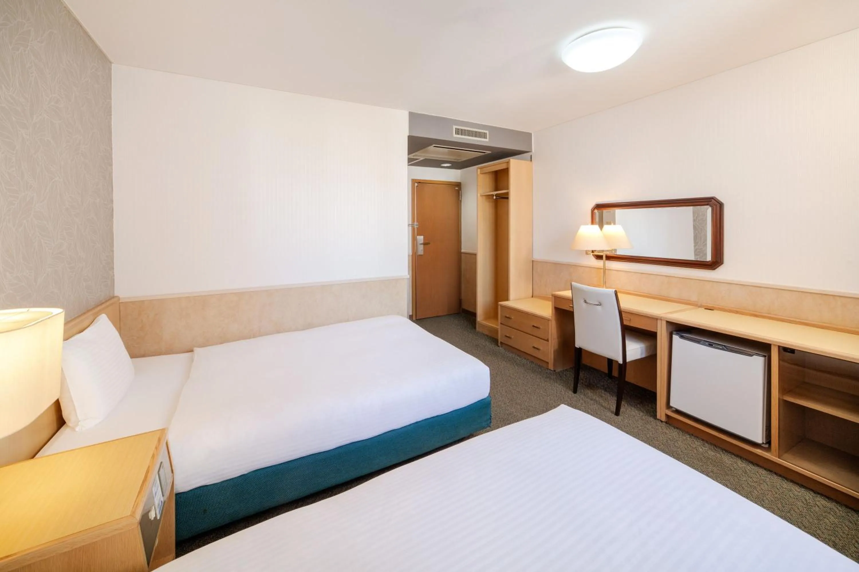 Bed in Central Hotel Sasebo