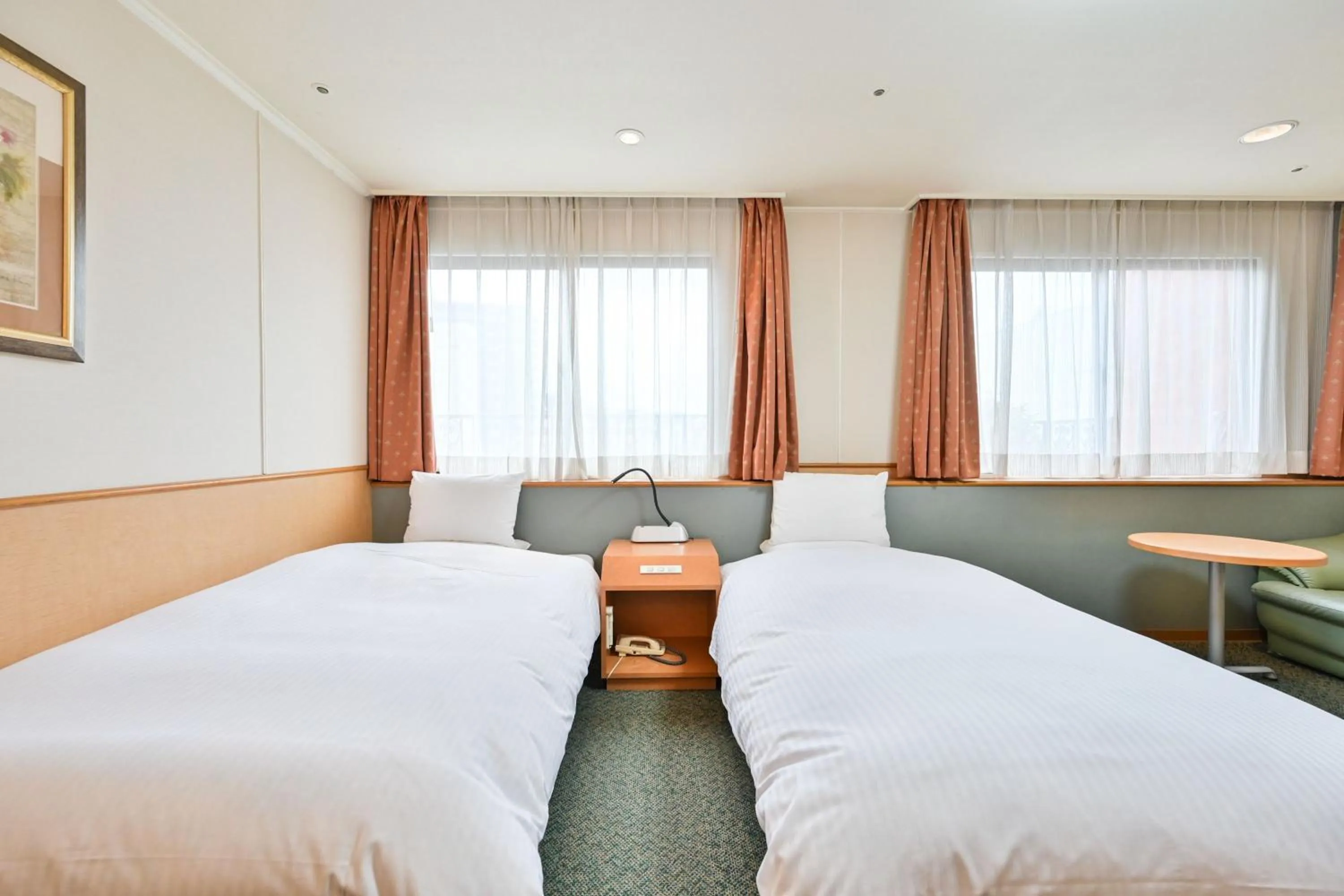 Bed in Central Hotel Sasebo